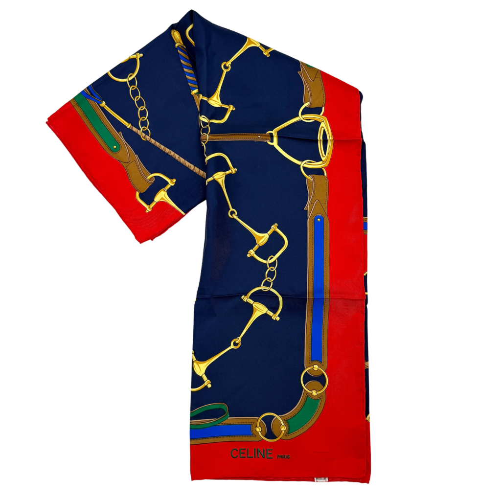Celine silk scarf featuring a bold equestrian motif in navy, red, green, and gold.