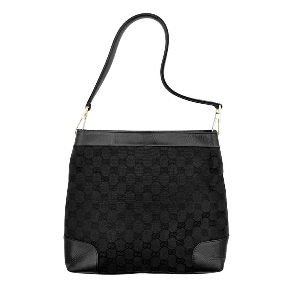 Gucci GG Monogram Bucket Shoulder Bag in black canvas and leather with silver-tone hardware, shown on a white background.