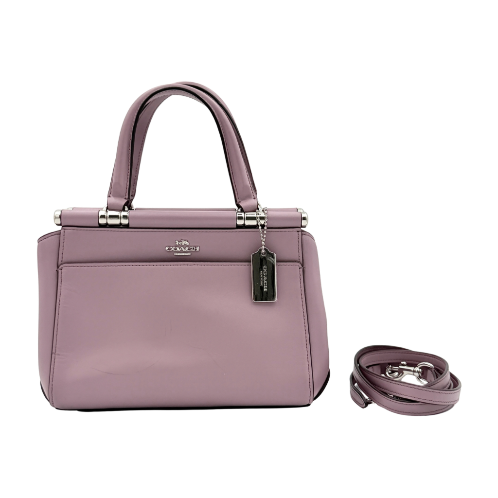 Coach Grace 20 bag in pink leather with silver hardware, shown with its detachable strap.