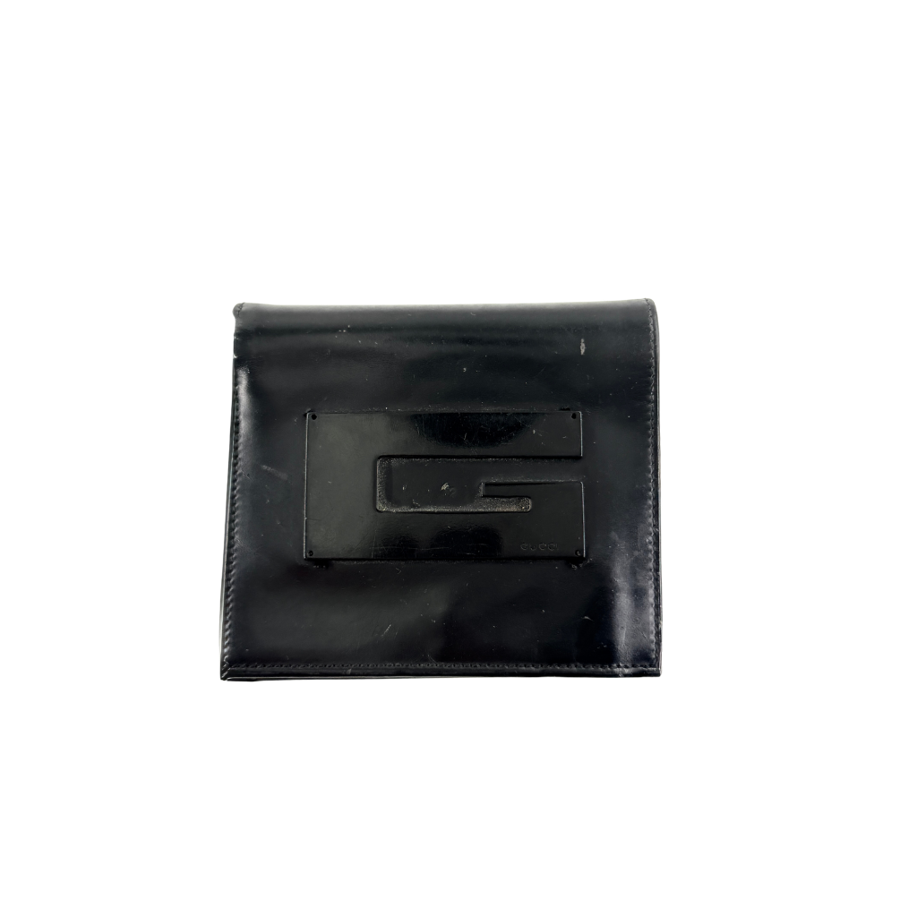 Gucci G Logo Bifold Wallet in black leather featuring a bold geometric G plaque and meticulously stitched edges.
