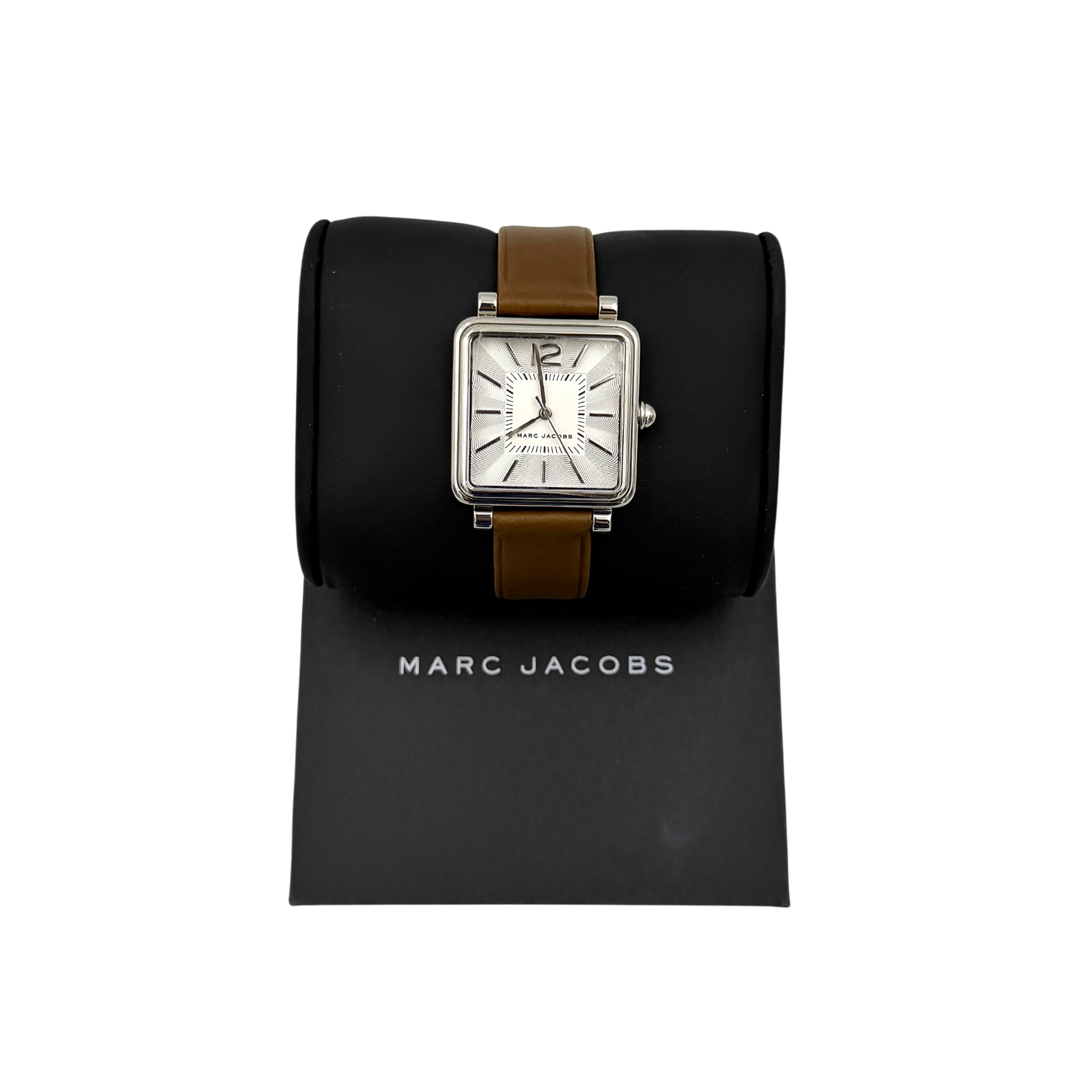 Marc Jacobs MJ1436 silver square watch with brown leather strap displayed on a branded watch cushion.