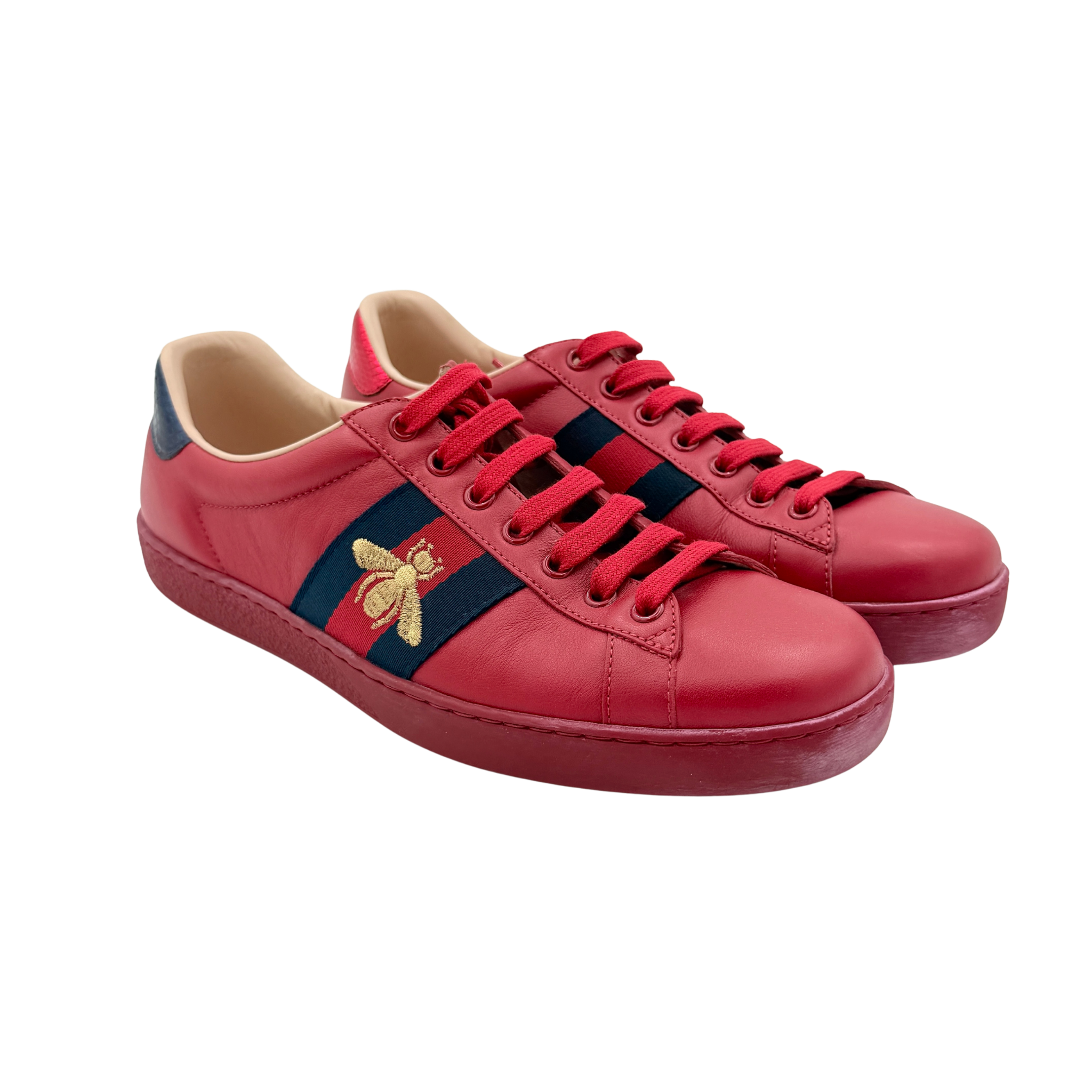 Gucci Ace Embroidered Bee sneakers in red leather with navy and red stripes and gold bee detail.