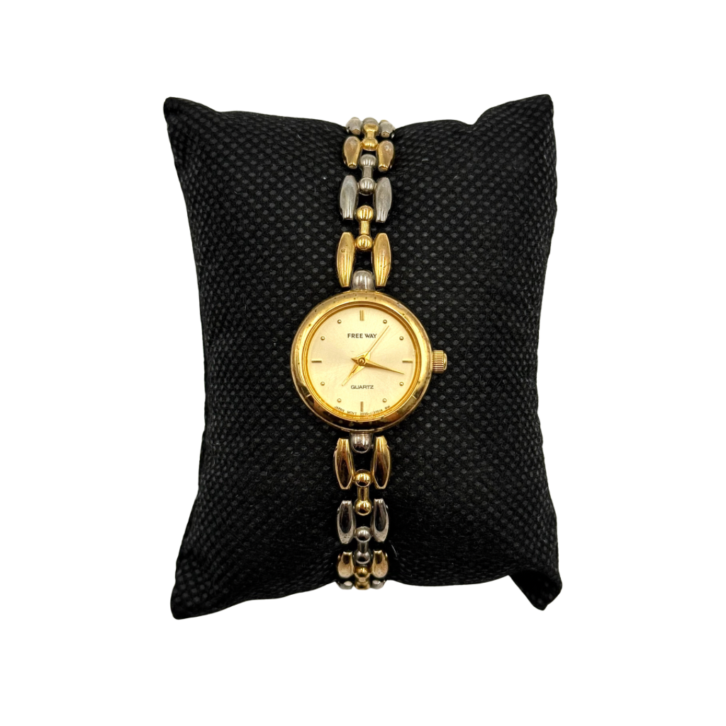 Citizen Free Way two-tone quartz watch with gold and silver link bracelet displayed on a black cushion.