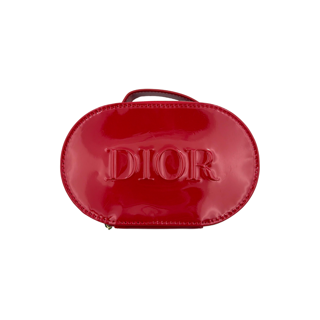 Christian Dior patent leather cosmetic pouch in glossy red with embossed DIOR logo and gold zip hardware.