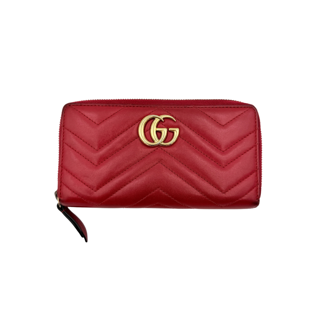 Gucci GG Marmont quilted long wallet in red leather with gold hardware displayed flat against a white background.