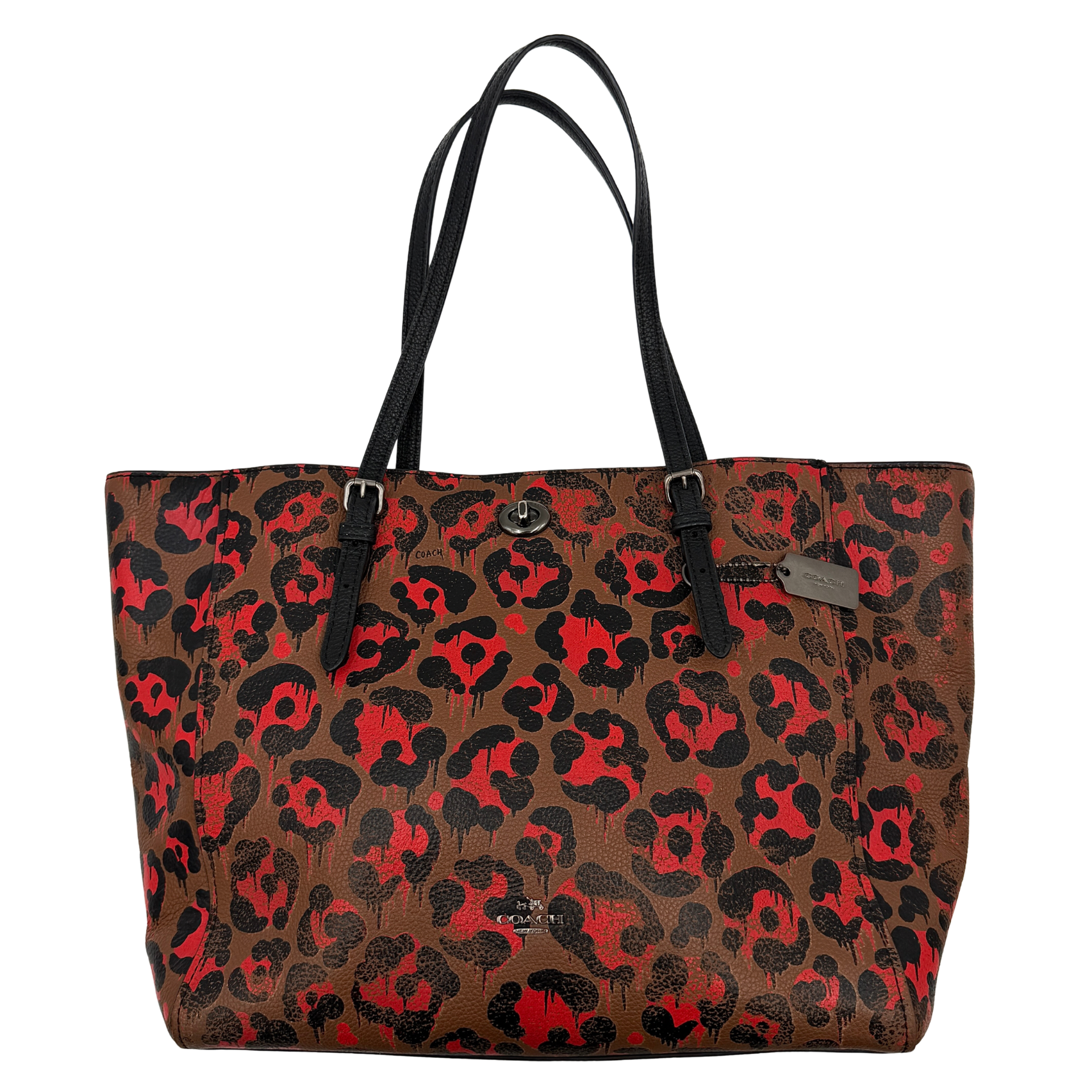 Coach City Tote in brown coated canvas, drenched in a vivid red and black leopard print, with black leather handles and silver hardware details.