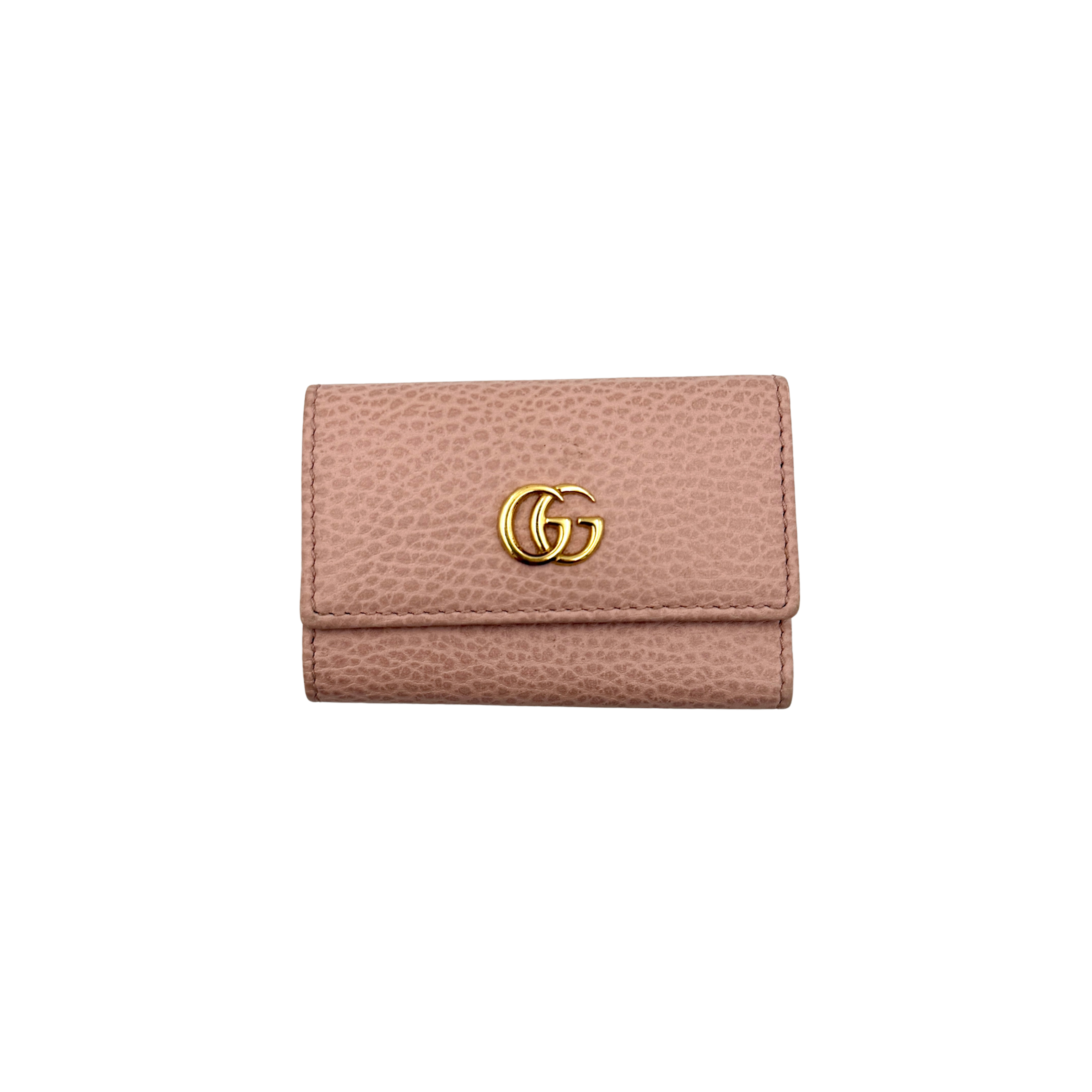 Gucci GG Marmont pink leather key case with gold GG emblem and grained texture, presented in a structured trifold shape.