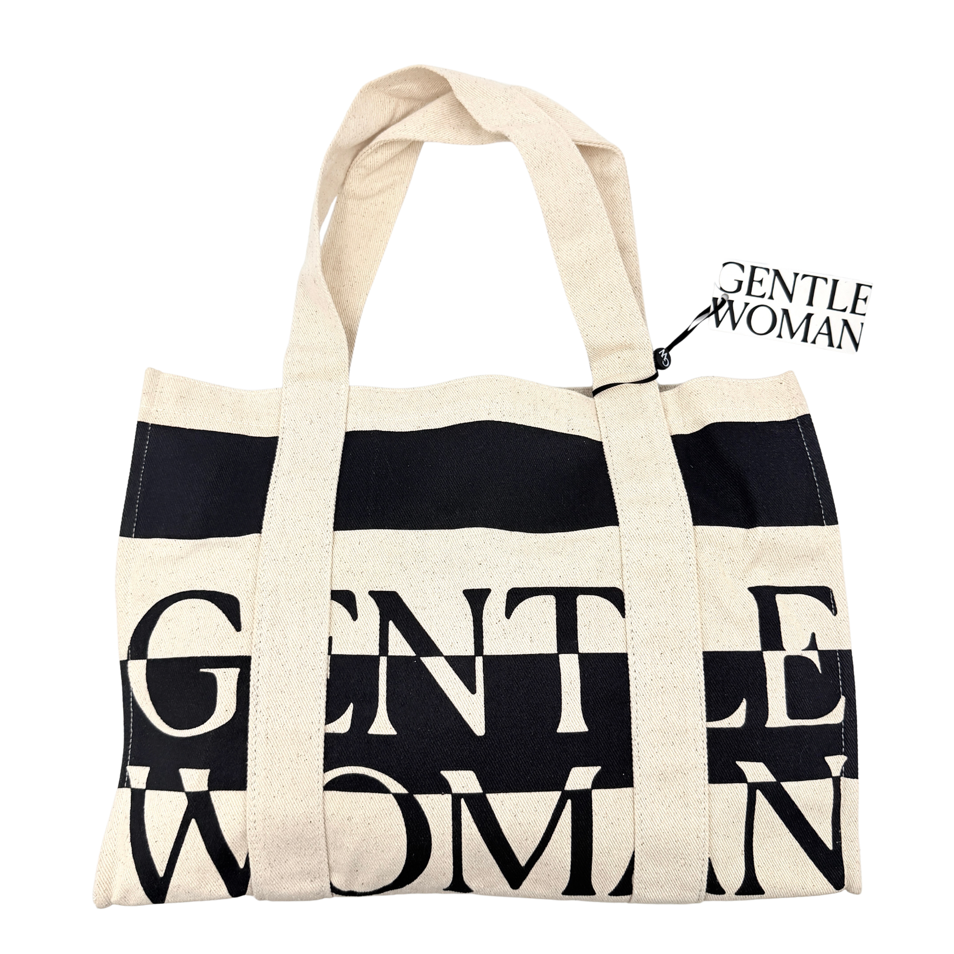 Gentlewoman Canvas Tote Bag in cream and black canvas with bold oversized logo and twin carry handles.