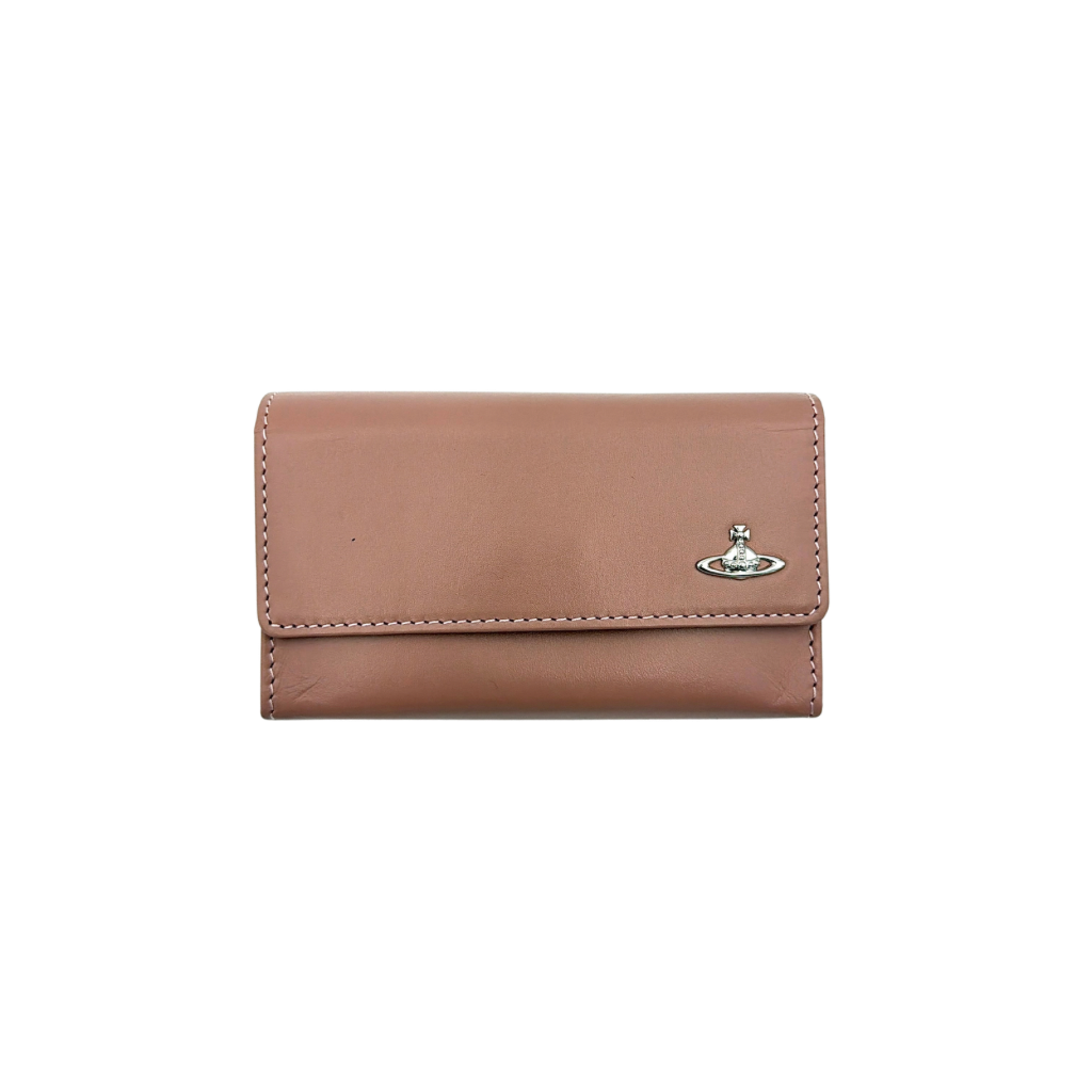 Vivienne Westwood pink leather wallet with silver signature Orb hardware, styled against a clean background.