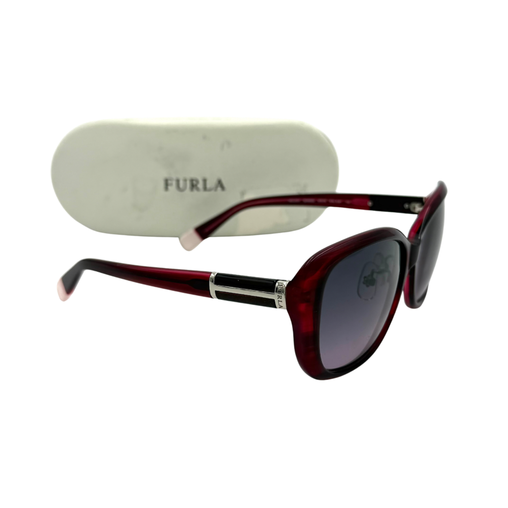 Furla SU4925J sunglasses in dark red acetate with butterfly-shaped frames, silver-tone hardware, and gradient lenses, presented alongside a Furla hard case.