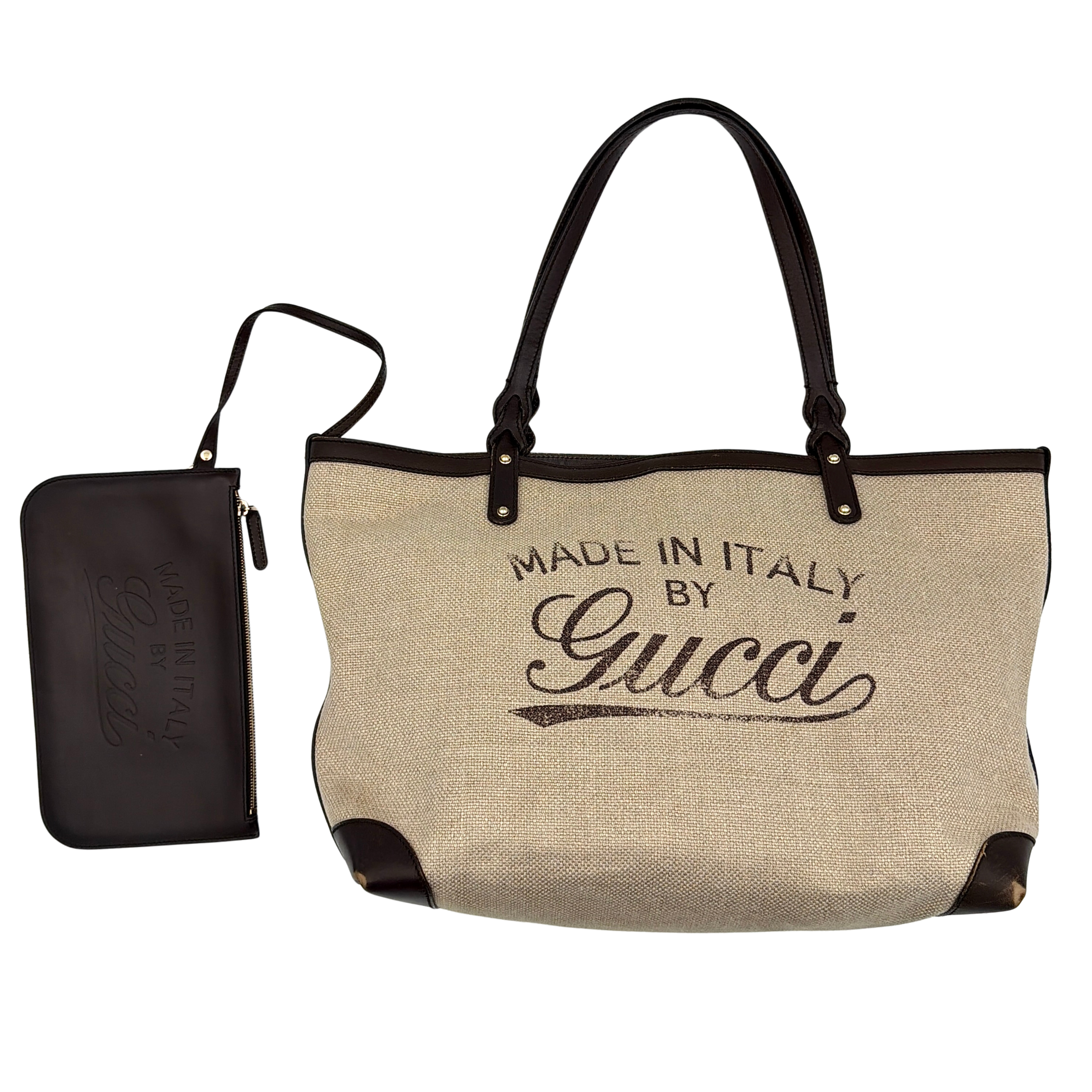 Gucci beige canvas shoulder bag with brown leather trim, bold Gucci logo, and matching detachable leather pouch.