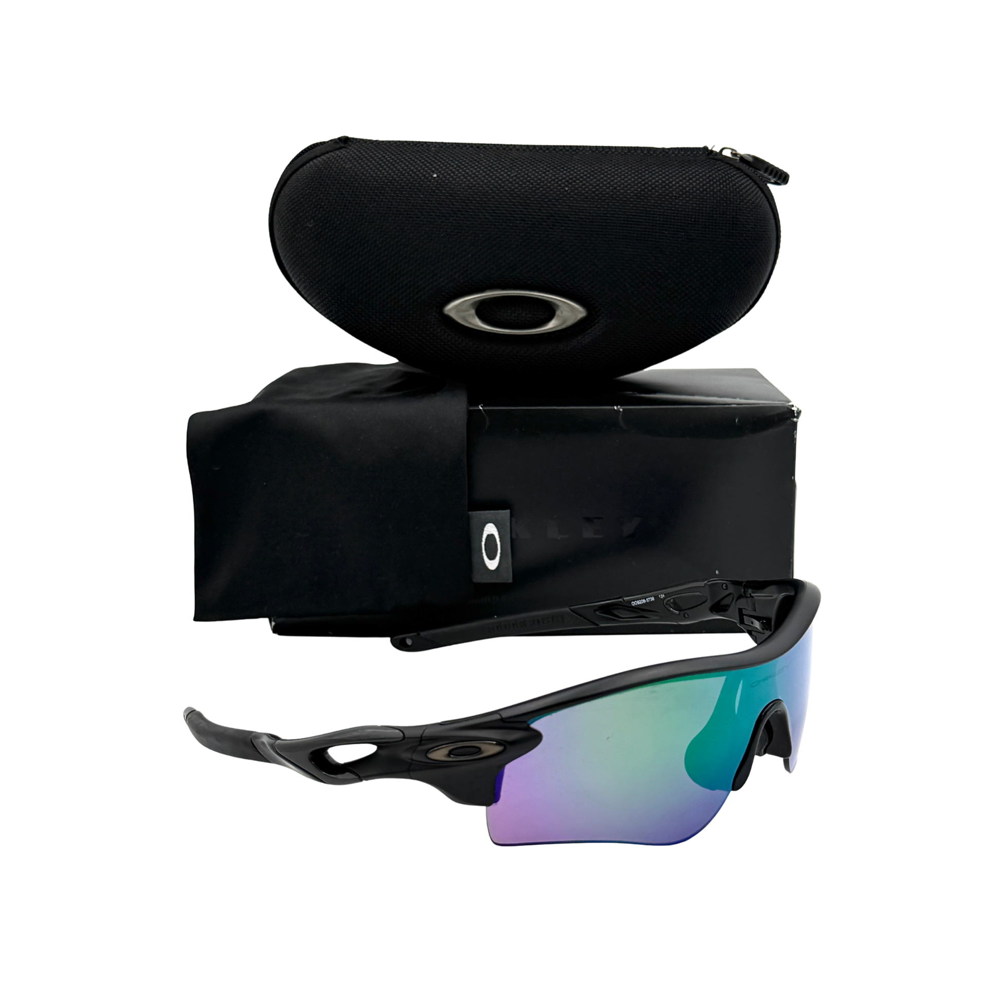 Oakley RadarLock Path sunglasses in matte black with reflective green and violet Prizm shield lens, presented with original black case, box, and cloth.