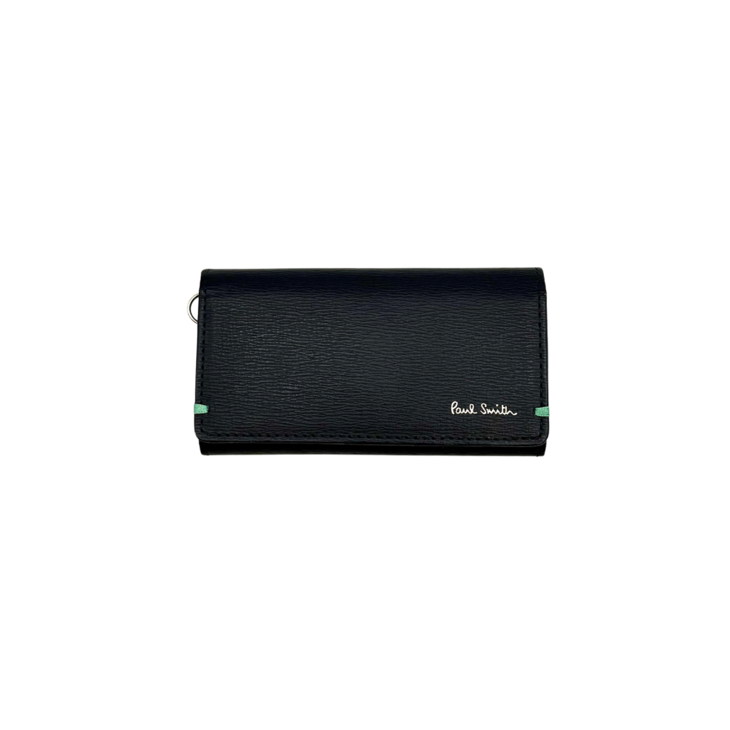 Paul Smith key case in grained black leather with Tiffany blue accents and silver logo, displayed on a white background.