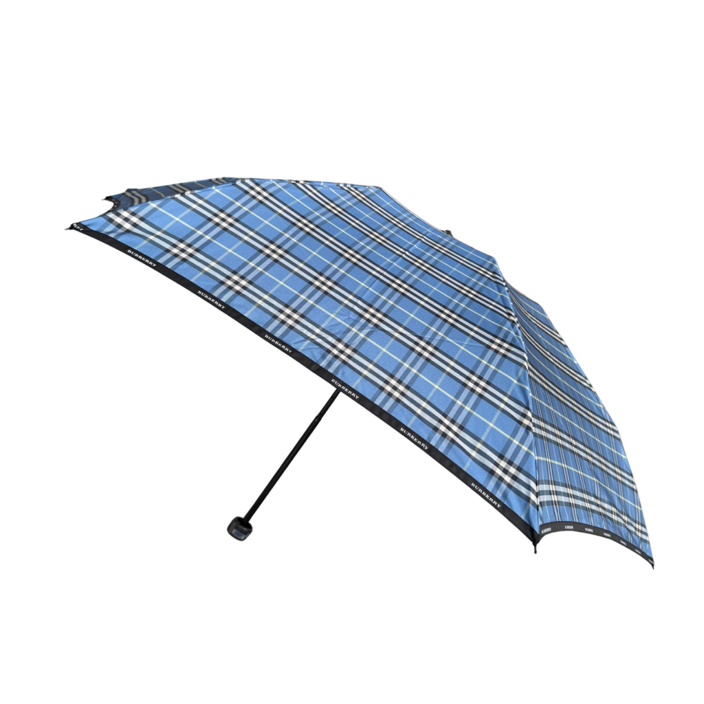 Burberry folding umbrella and matching pouch in blue Nova Check plaid, perfectly folded to showcase its classic pattern and refined finish.