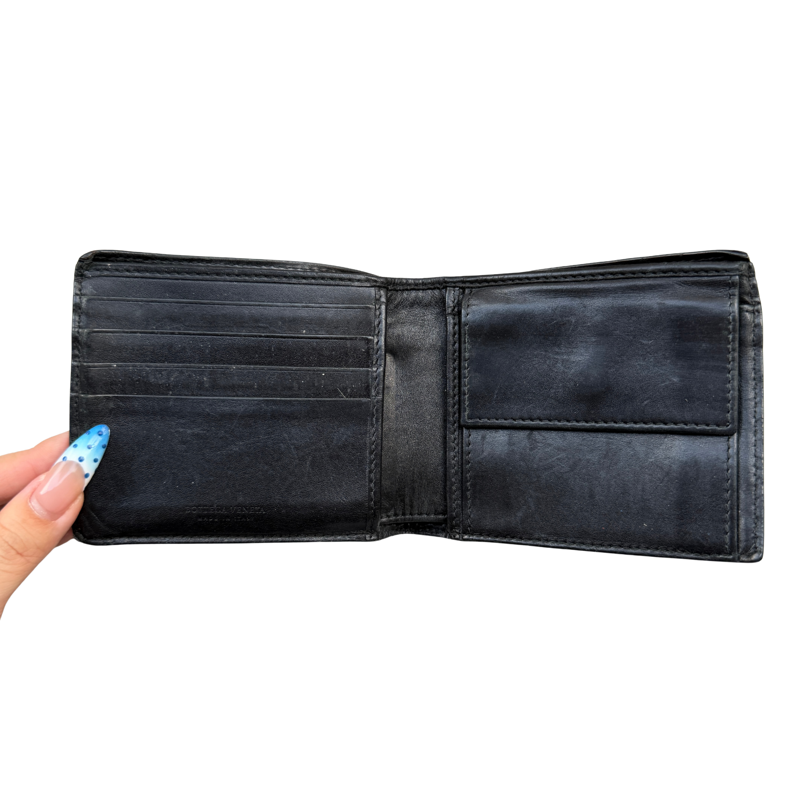 Bottega Veneta Intrecciato wallet in black leather featuring the iconic woven design and a structured rectangular shape.