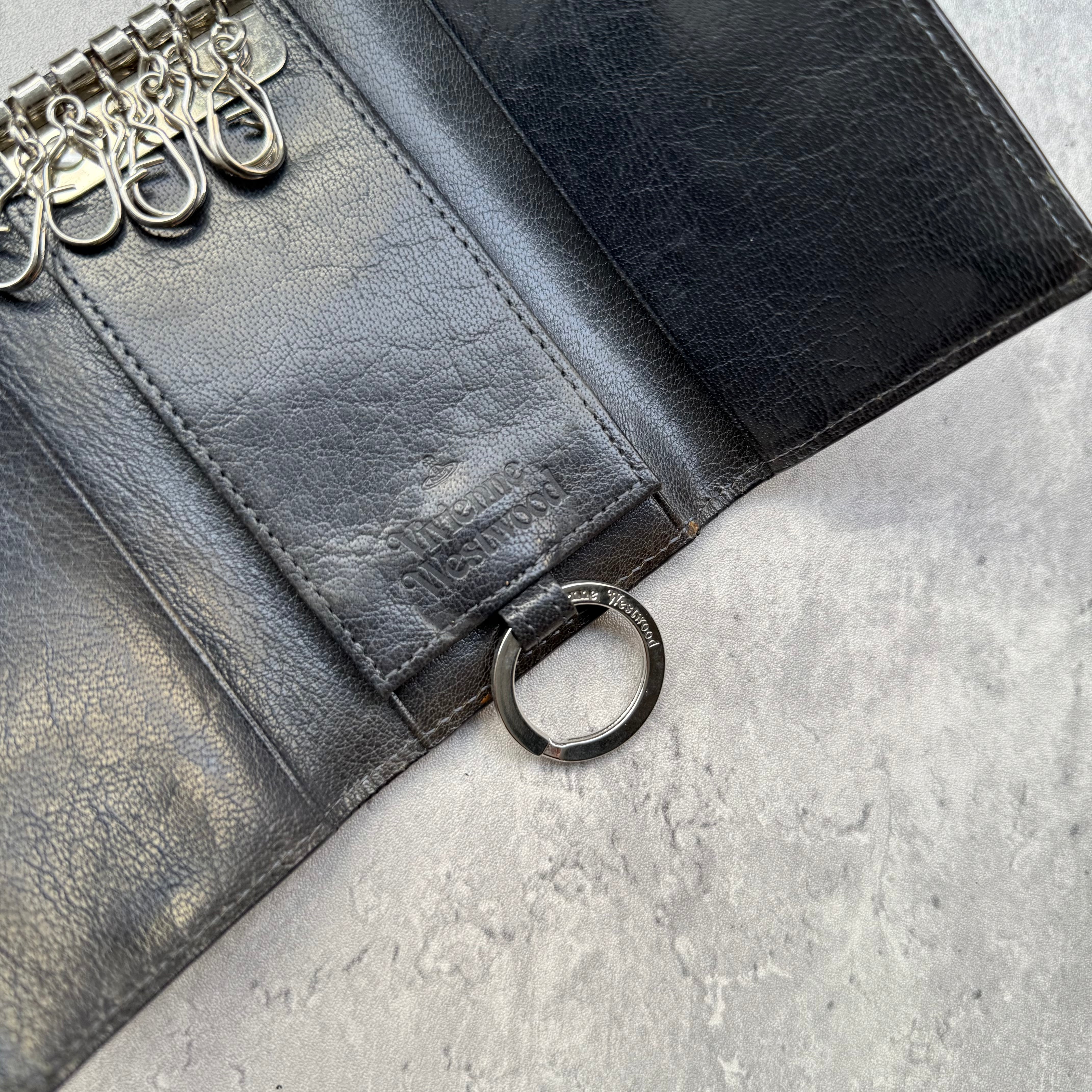 Vivienne Westwood Grey Leather Key Holder with Orb logo, loop-through tab closure, and interior key hooks