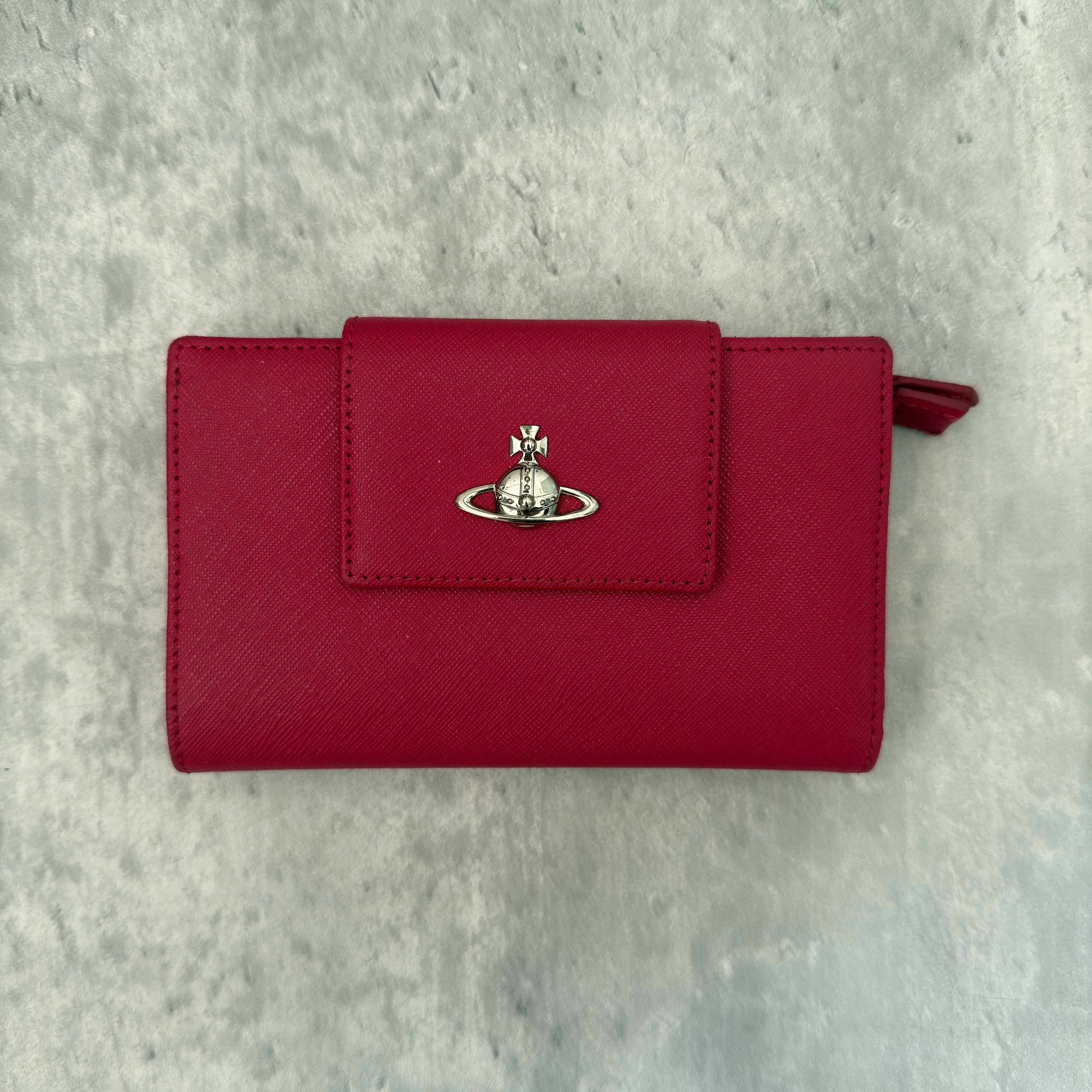 Vivienne Westwood Logo Orb Clip Wallet in Rose Pink Saffiano Leather with silver-tone emblem, card slots, and zippered coin pouch.