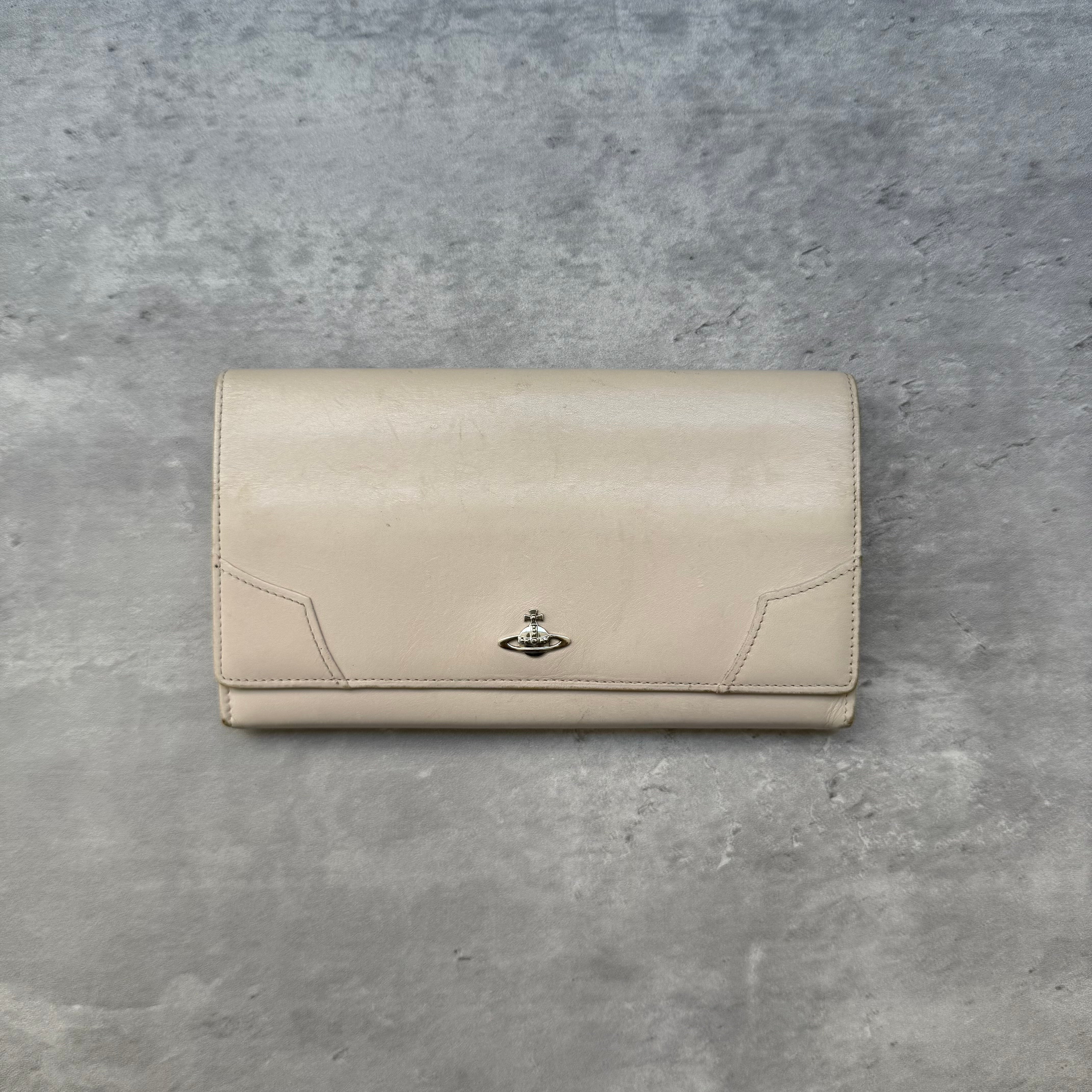 Vivienne Westwood Orb Long Wallet Cream leather with silver-tone Orb emblem and striped interior lining.