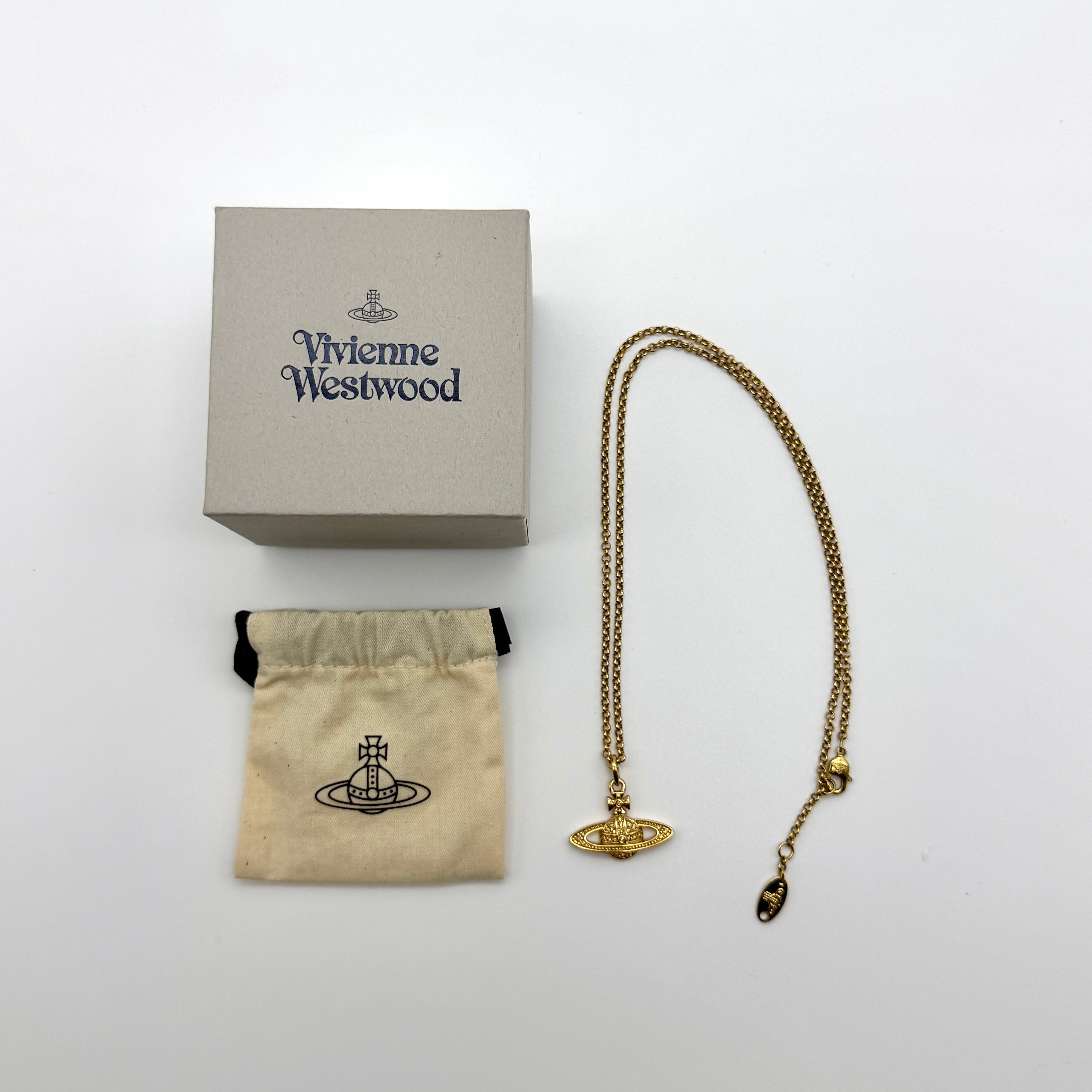 Vivienne Westwood Orb Necklace in gold-tone metal with crystal-encrusted orb pendant, including box and dust pouch — pre-loved.