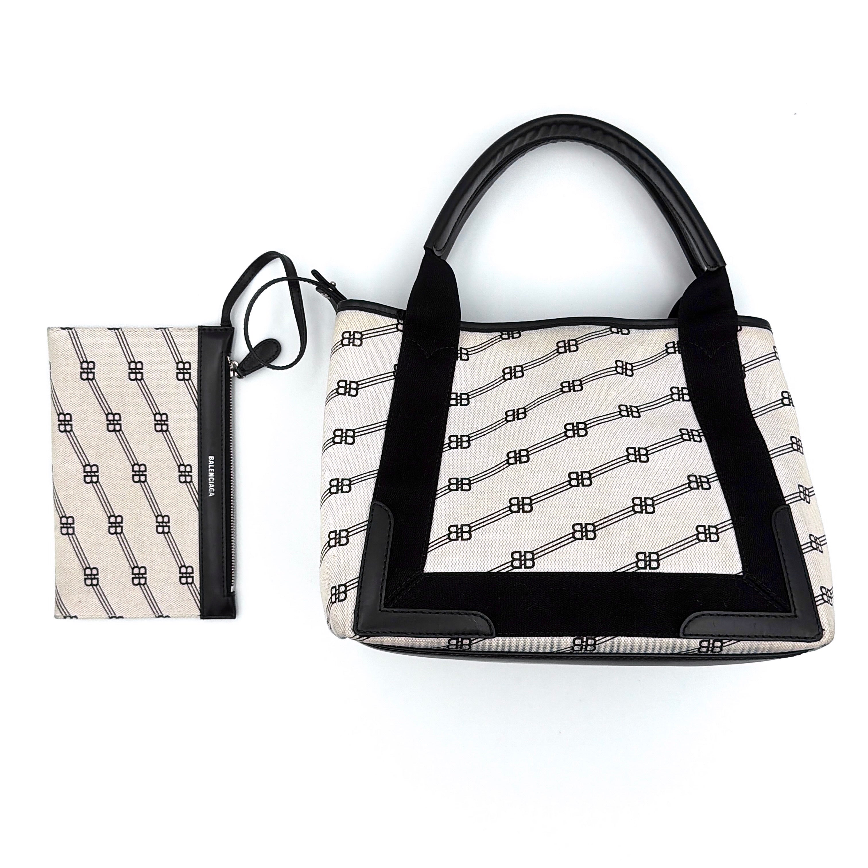 Balenciaga BB Navy Cabas tote bag in black and cream with BB monogram print, contrast black trim, top handles, and matching removable pouch.