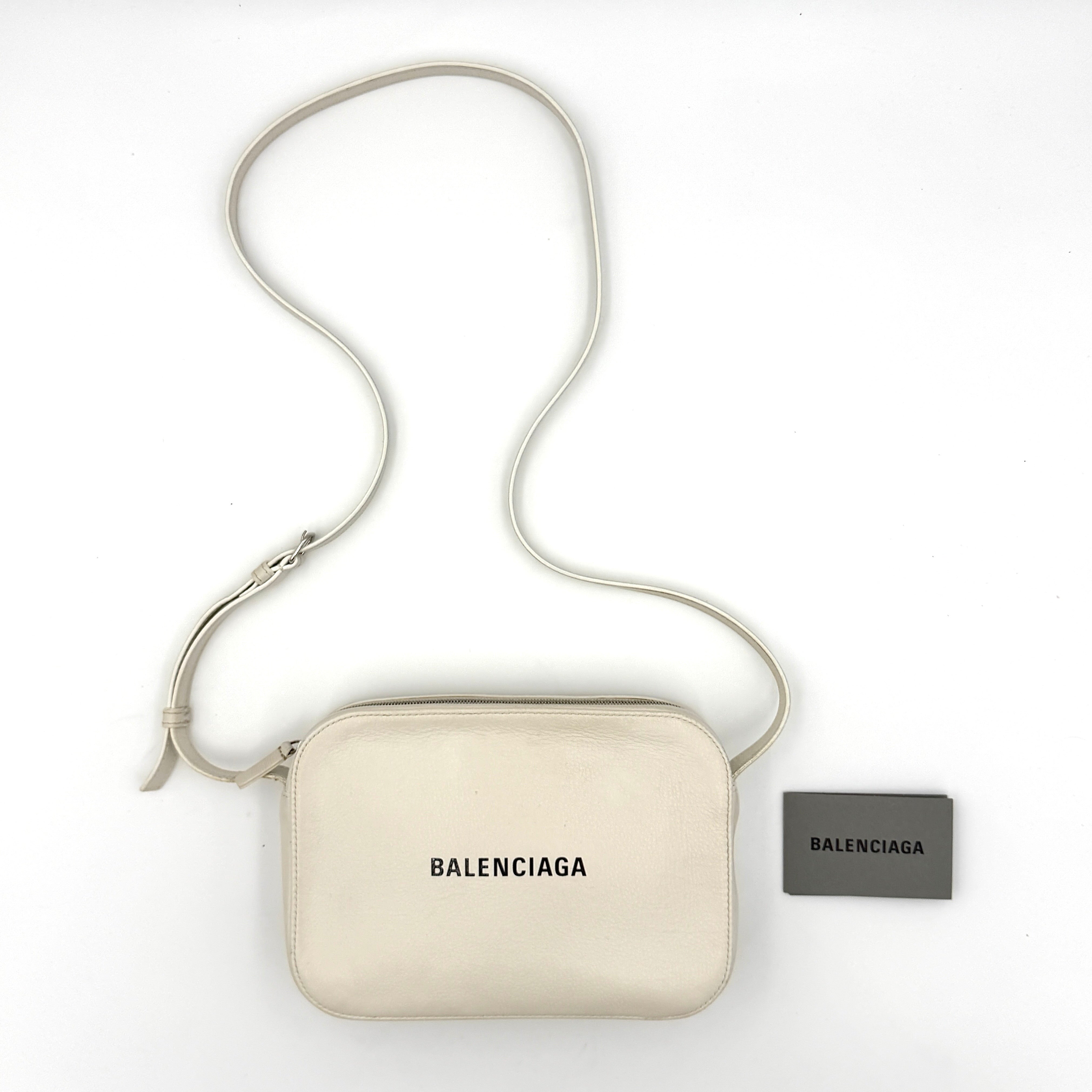 Balenciaga Everyday Camera Crossbody Bag in white smooth leather with adjustable strap and logo print
