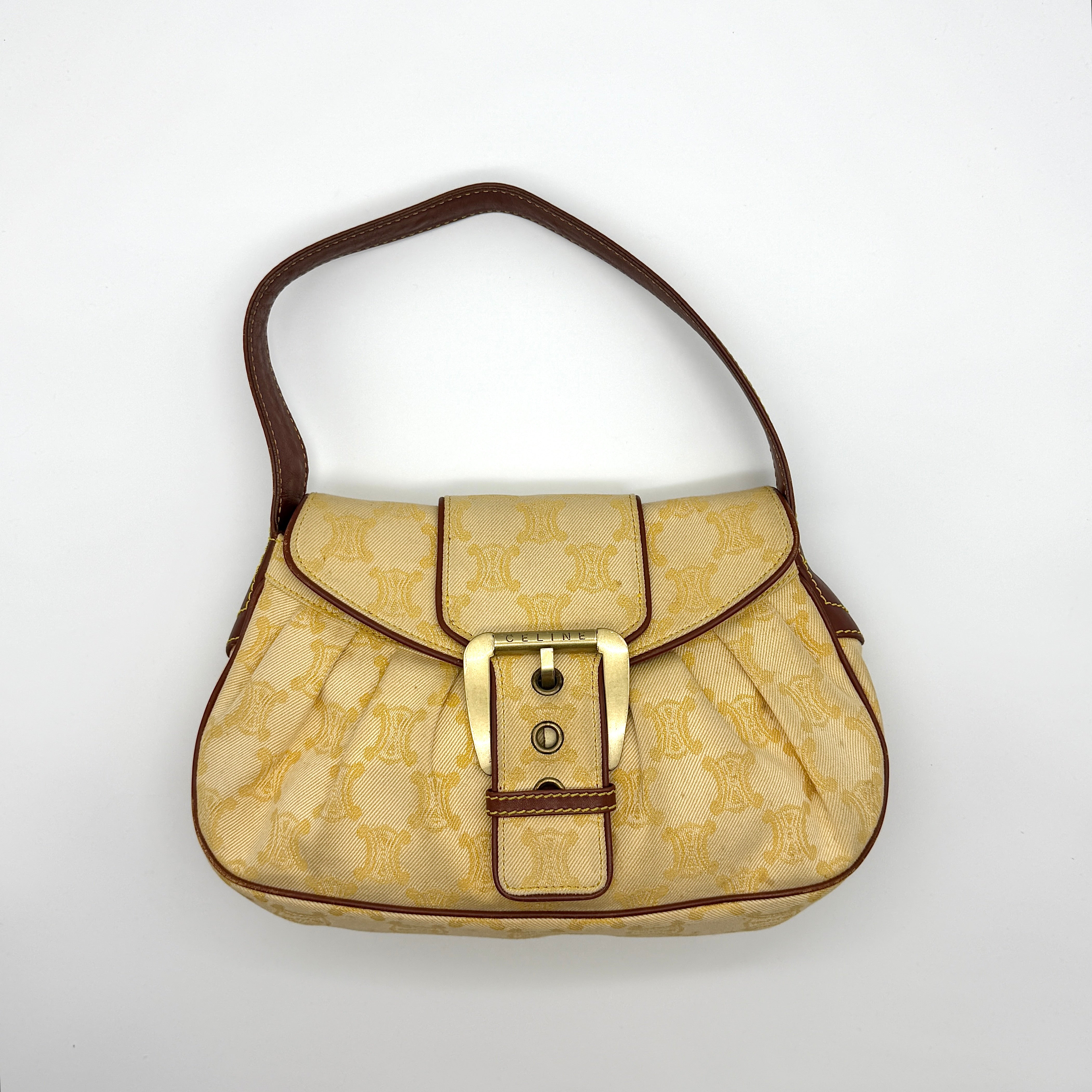 Celine Triomphe Macadam One Shoulder Bag in beige jacquard canvas with brown leather trim and gold-tone buckle closure.