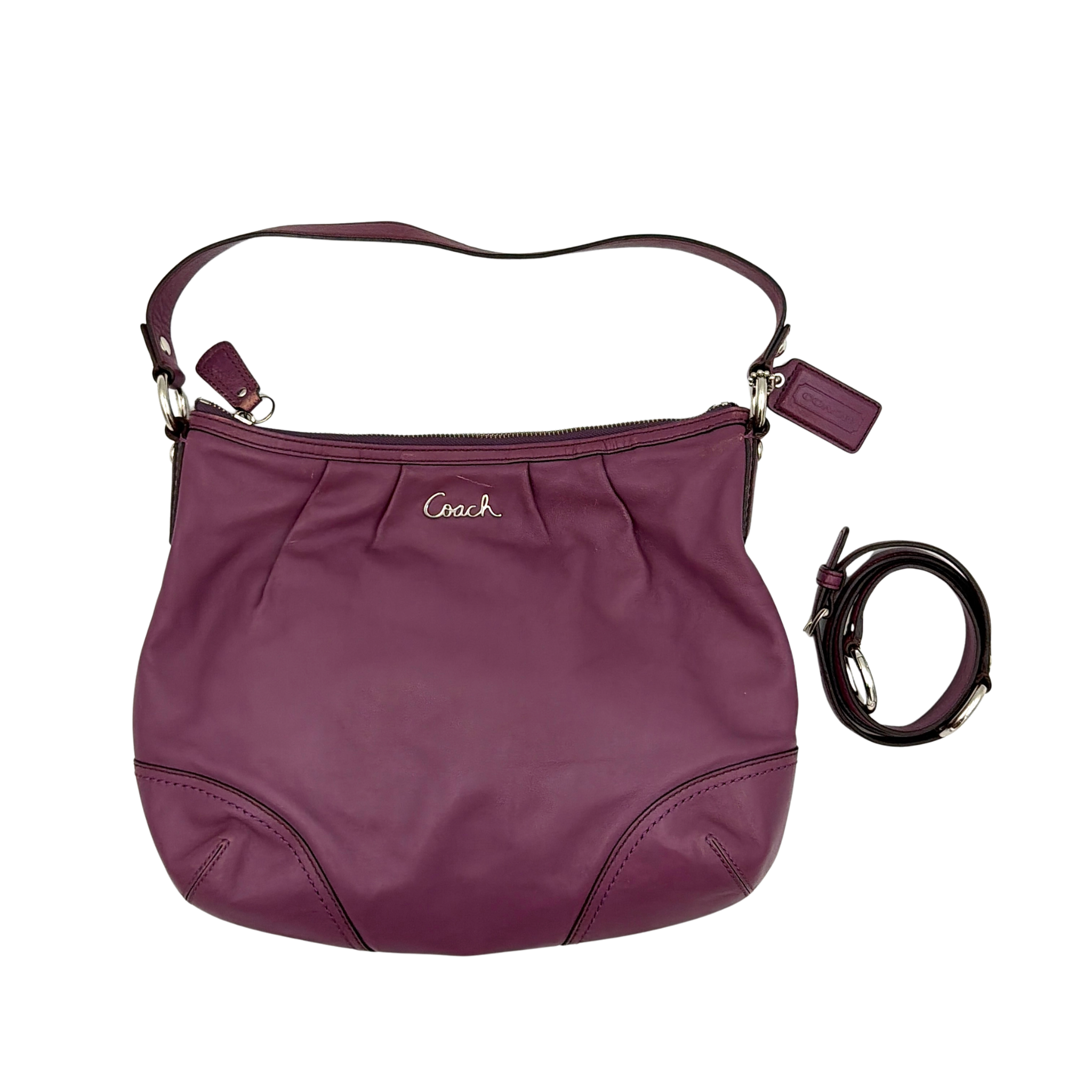 Coach 2Way Ashley hobo shoulder bag in purple leather featuring a slouchy silhouette, top zip closure, subtle Coach logo, and detachable long strap for crossbody wear.