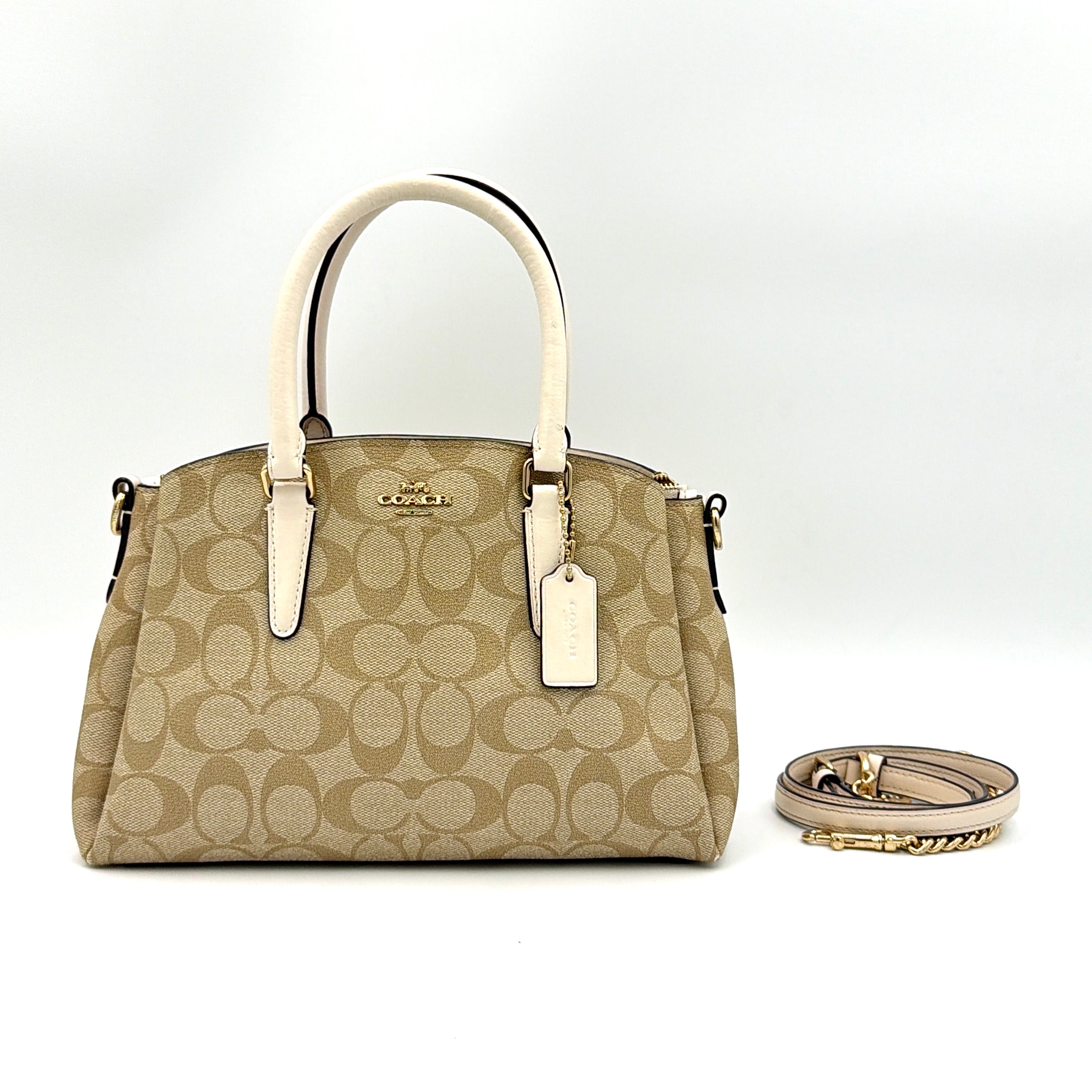 Coach 2Way Mini Sage Carryall Shoulder Bag in beige monogram canvas with white leather handles.