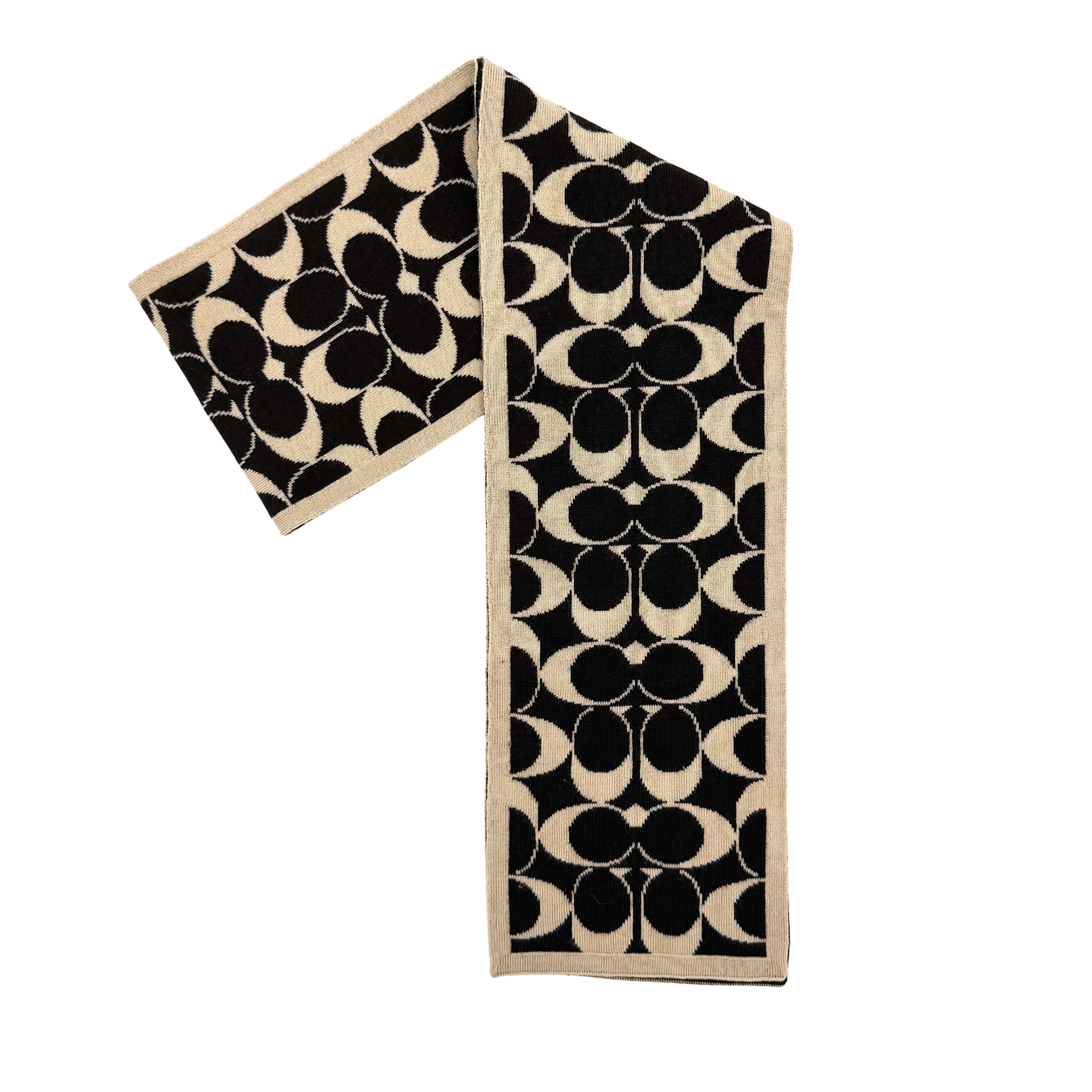 Coach monogram wool scarf in black and cream featuring signature C pattern and reversible striped design.