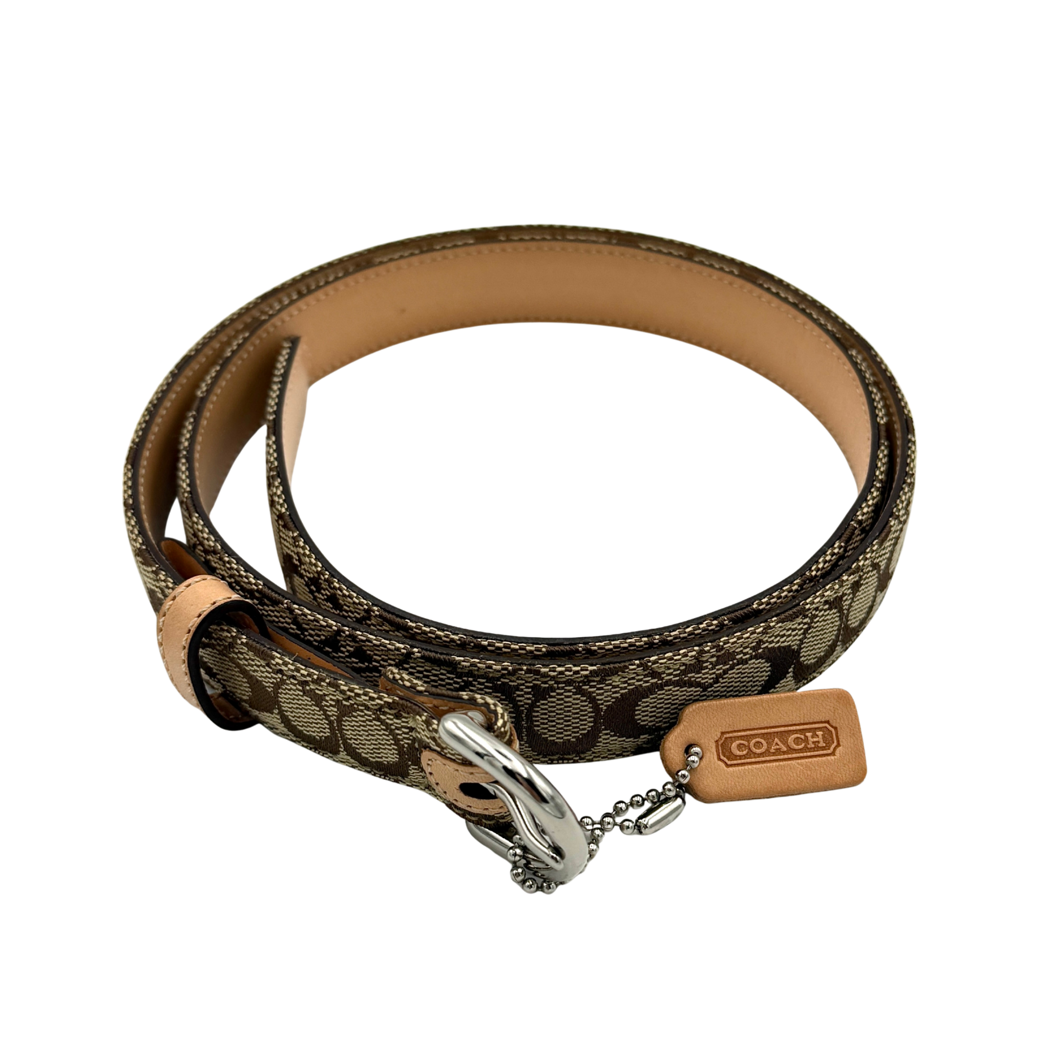 Coach signature canvas buckle belt in beige and tan featuring leather trim, silver-tone buckle hardware, and Coach logo tag detail.