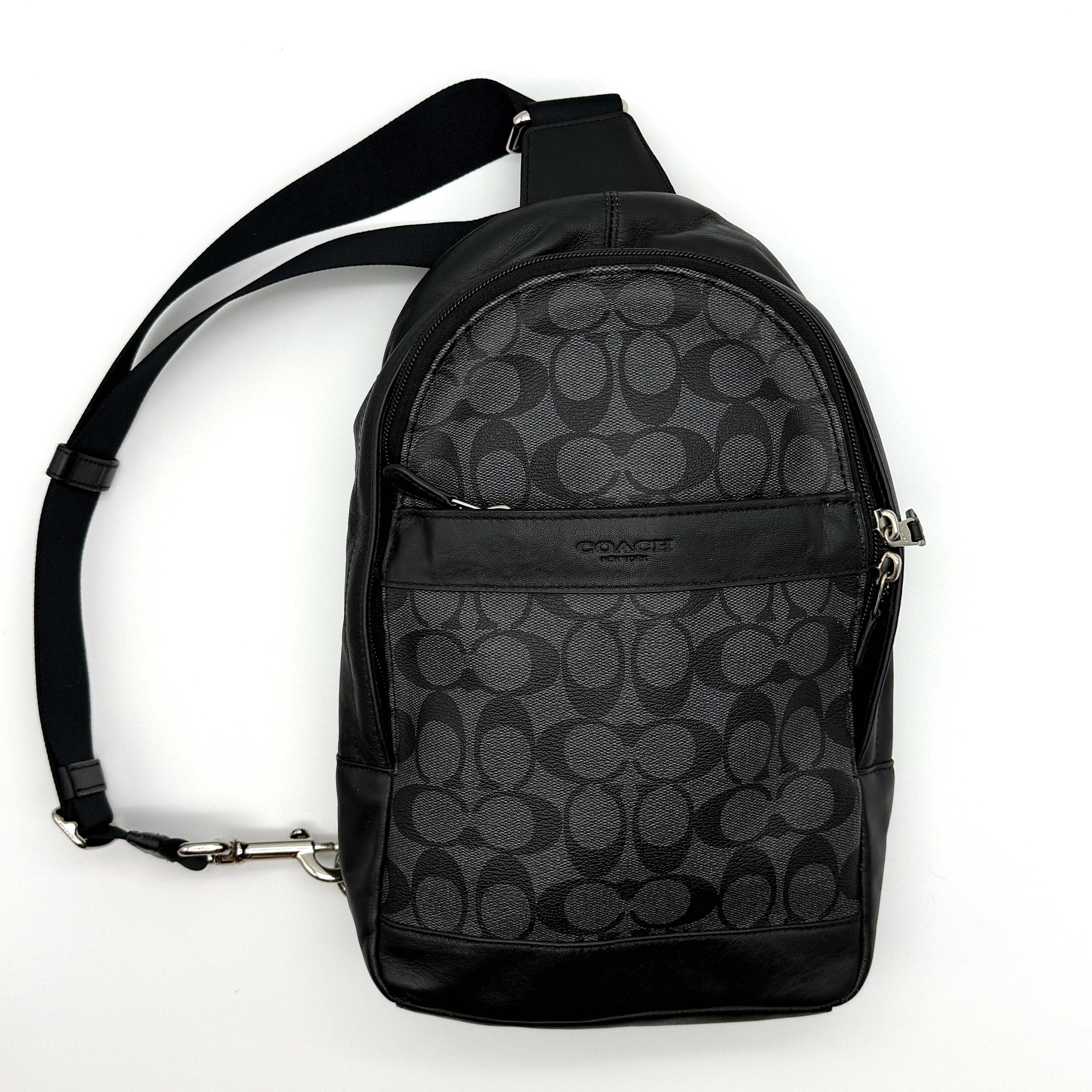 Coach Signature Charlie Crossbody Bag in black and grey coated canvas with leather trim and silver-tone hardware.