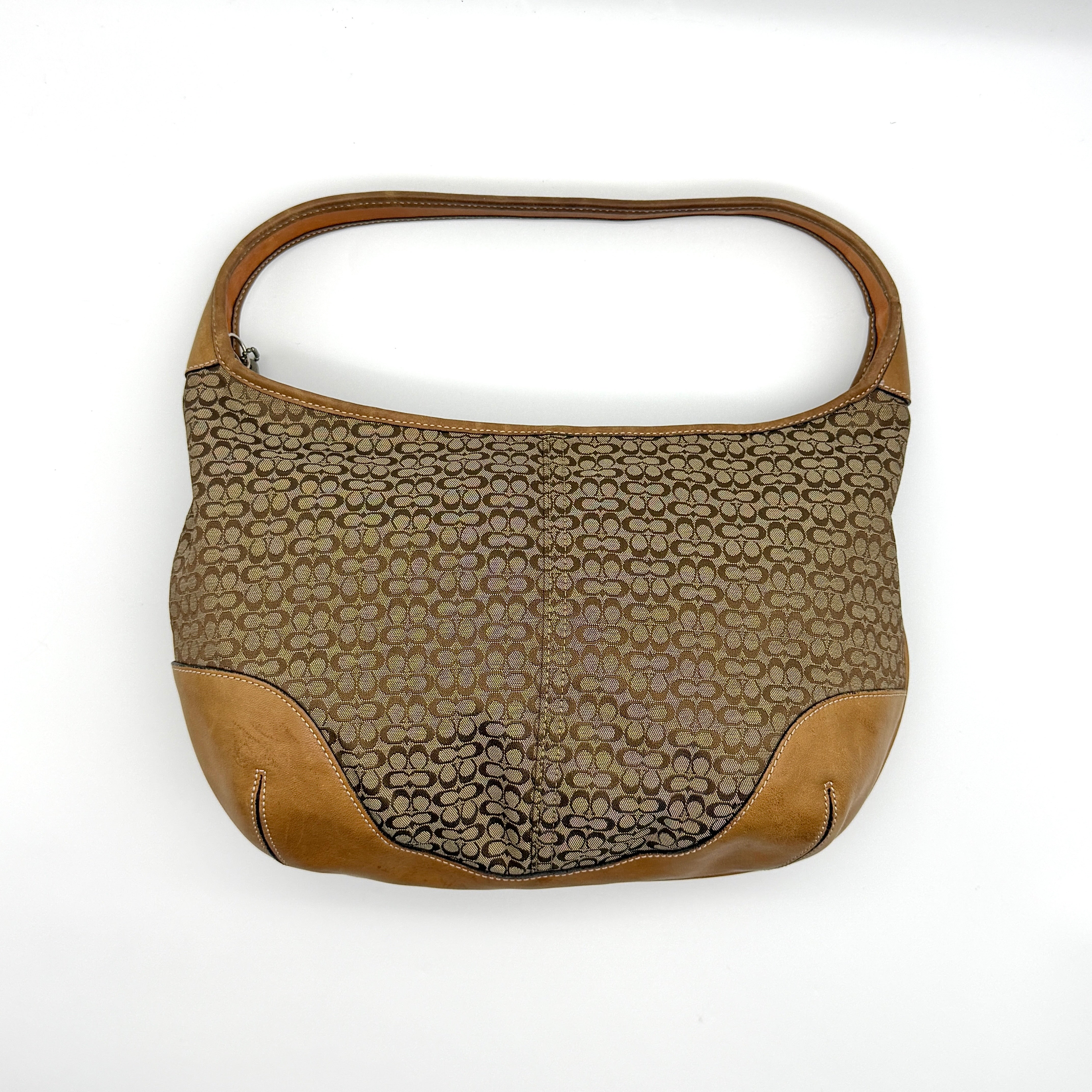 Coach Signature Ergo Shoulder Bag in beige and brown jacquard canvas with tan leather trim and silver-tone hardware.