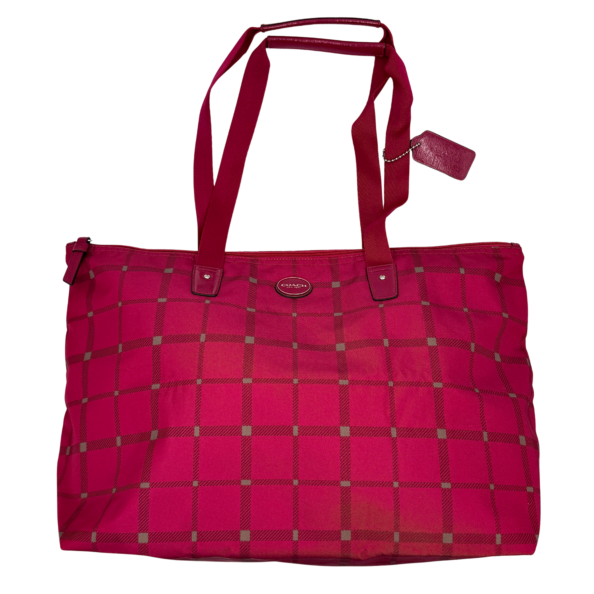 Coach Signature Getaway weekender tote bag in pink plaid nylon featuring a large travel silhouette, double shoulder straps, Coach logo patch, and top zip closure.