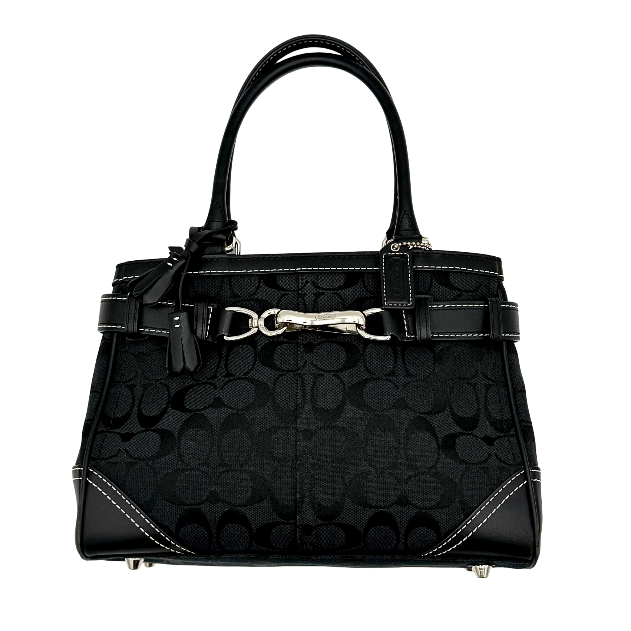 Coach Signature Hampton Carryall shoulder bag in black featuring signature jacquard fabric, leather trim, silver-tone hardware, contrast stitching, and structured top-handle silhouette.