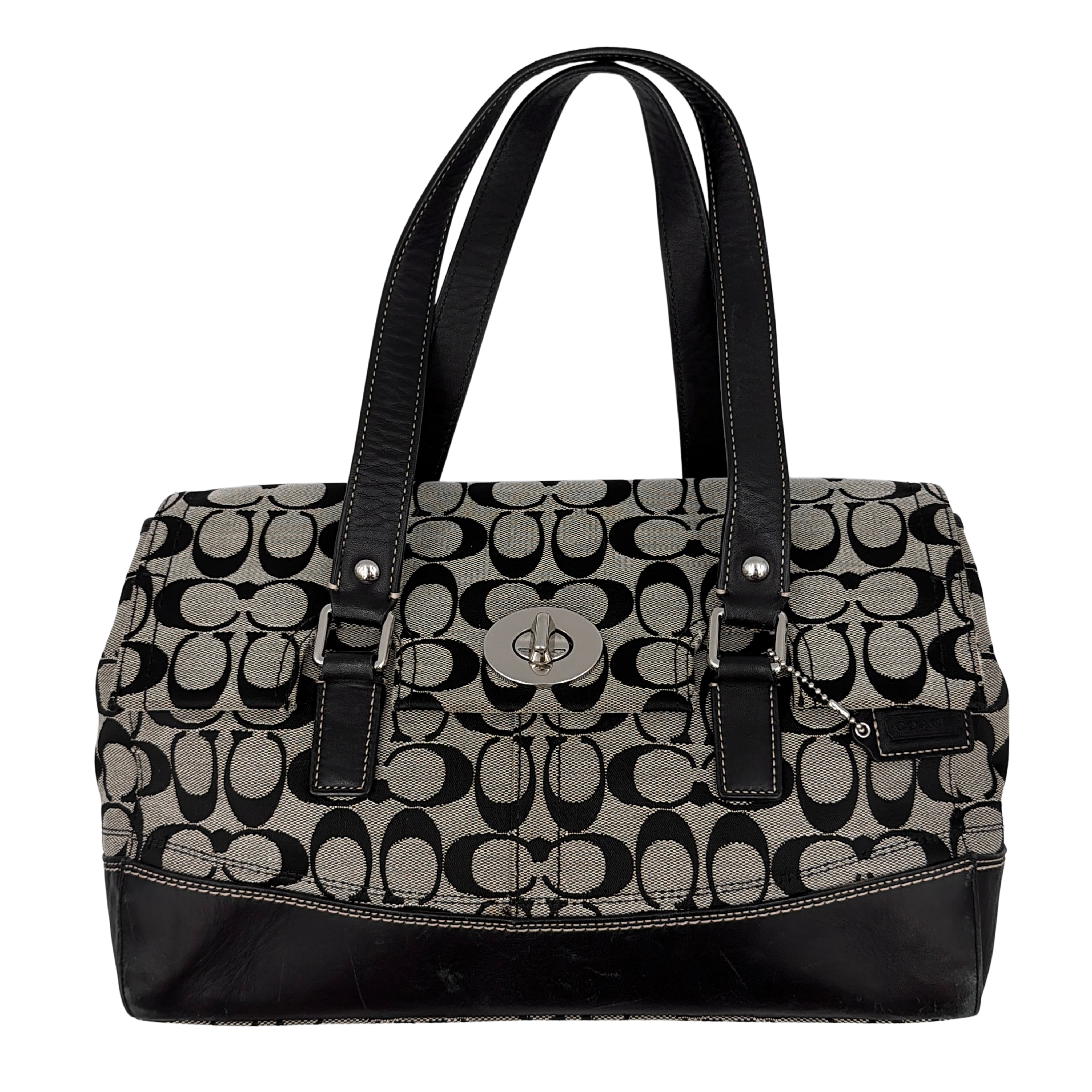 Coach Signature Hampton Turnlock Shoulder Bag in grey and black with iconic pattern, leather accents, and turnlock closure.