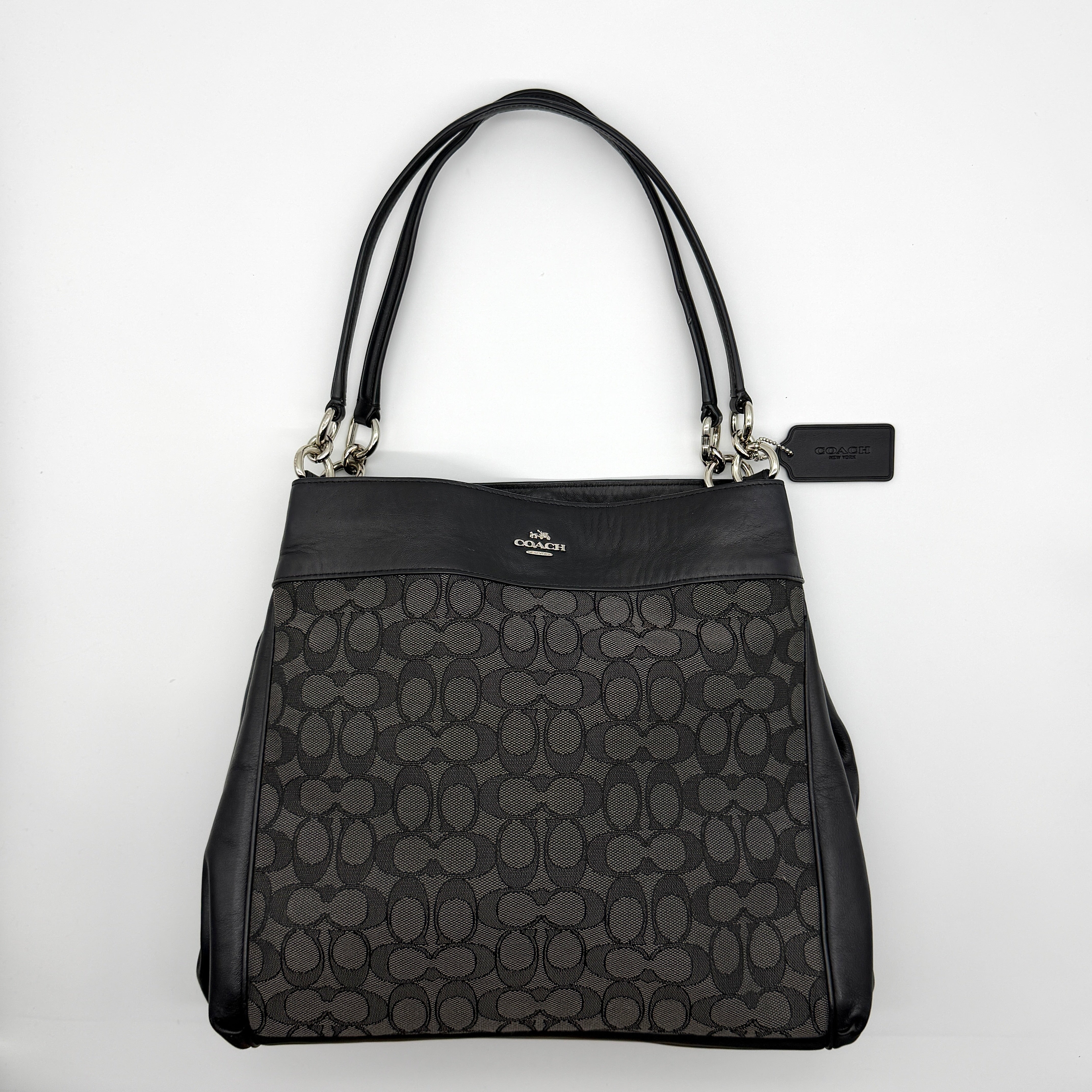 Coach Signature Lexy Shoulder Bag Black, crafted from jacquard canvas and smooth leather with silver-tone hardware and dual shoulder straps.