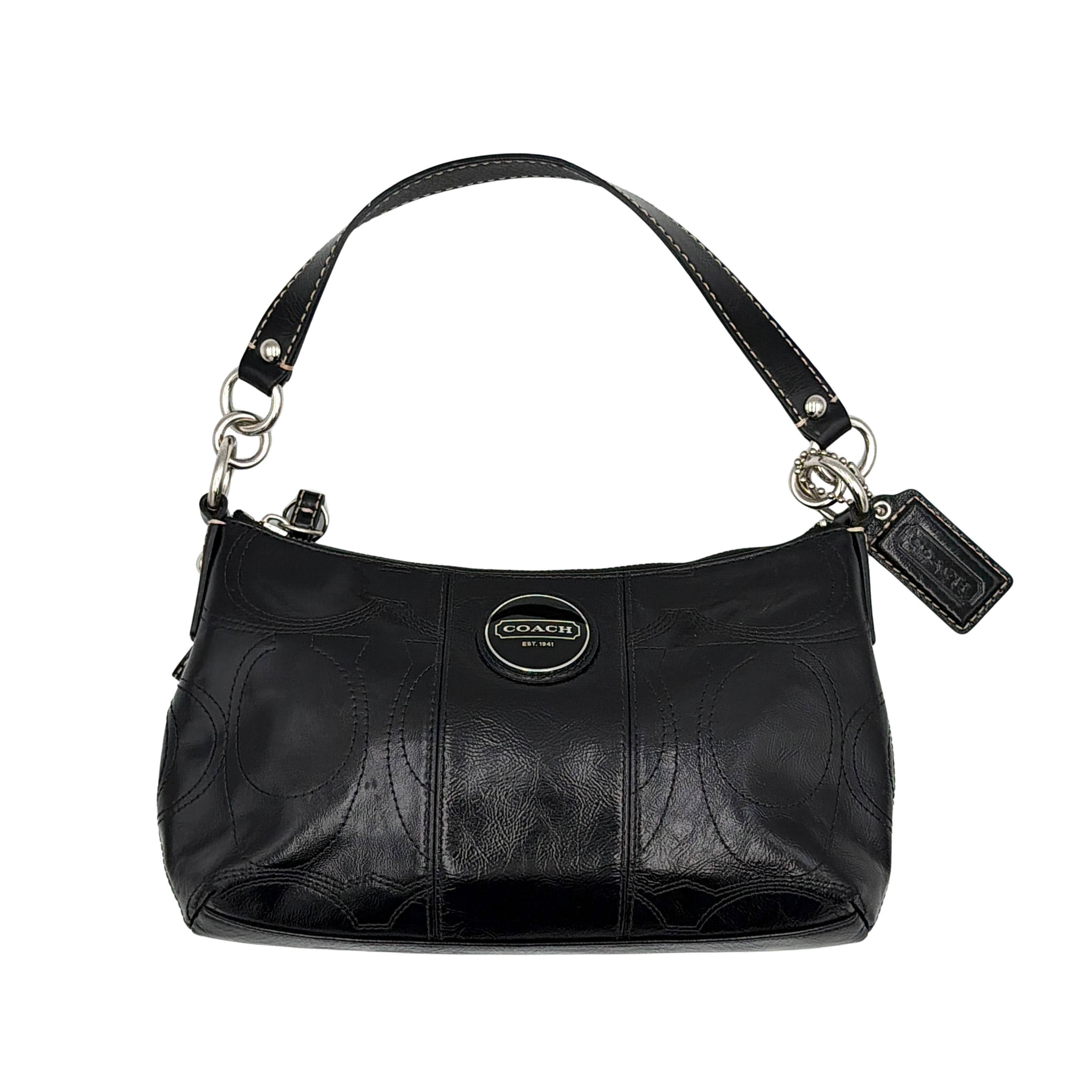Coach signature patent leather shoulder bag in black featuring embossed pattern, oval Coach logo plaque, and short shoulder strap