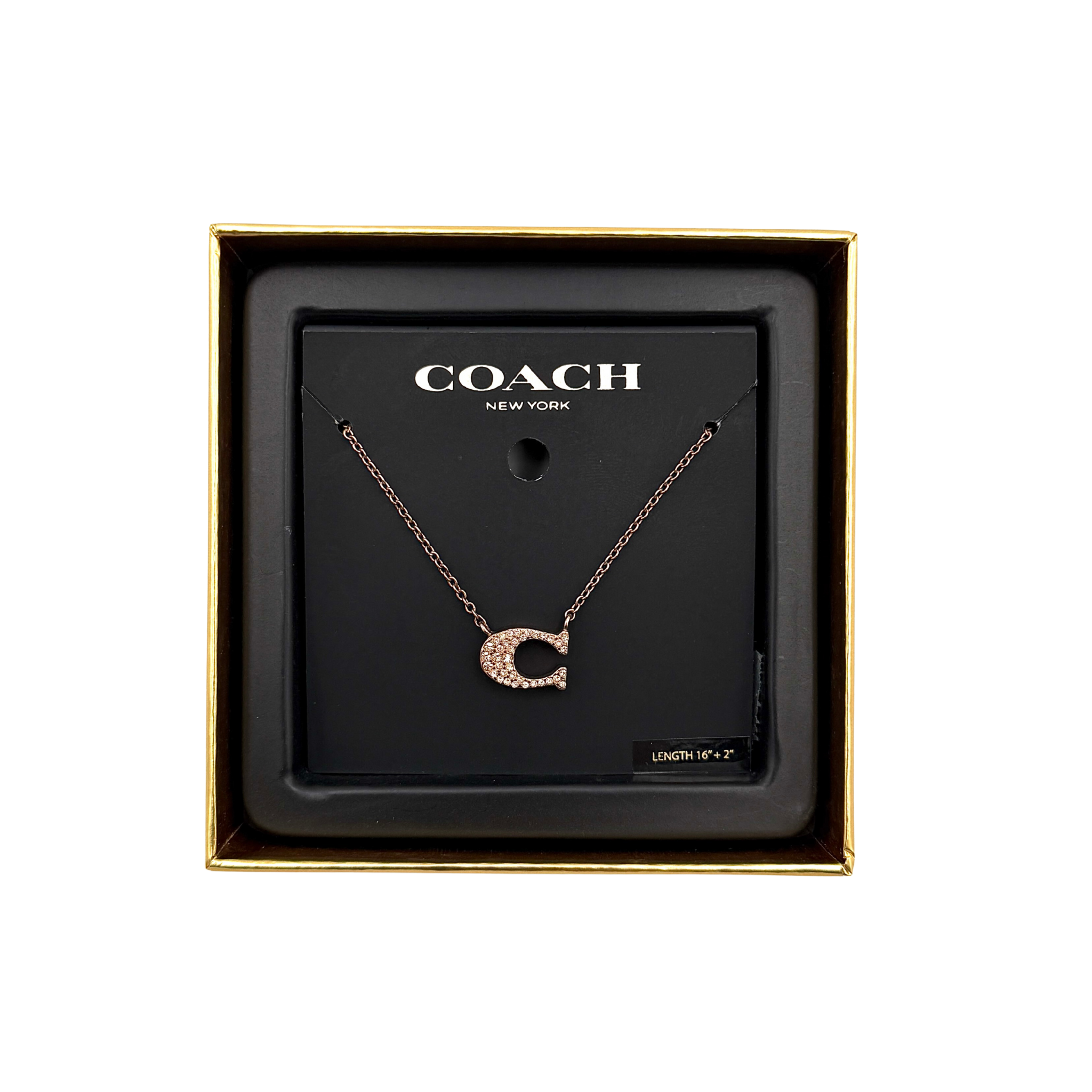 Coach signature pavé necklace in rose gold tone featuring a crystal pavé “C” pendant on a fine chain with lobster clasp, shown in Coach box packaging.