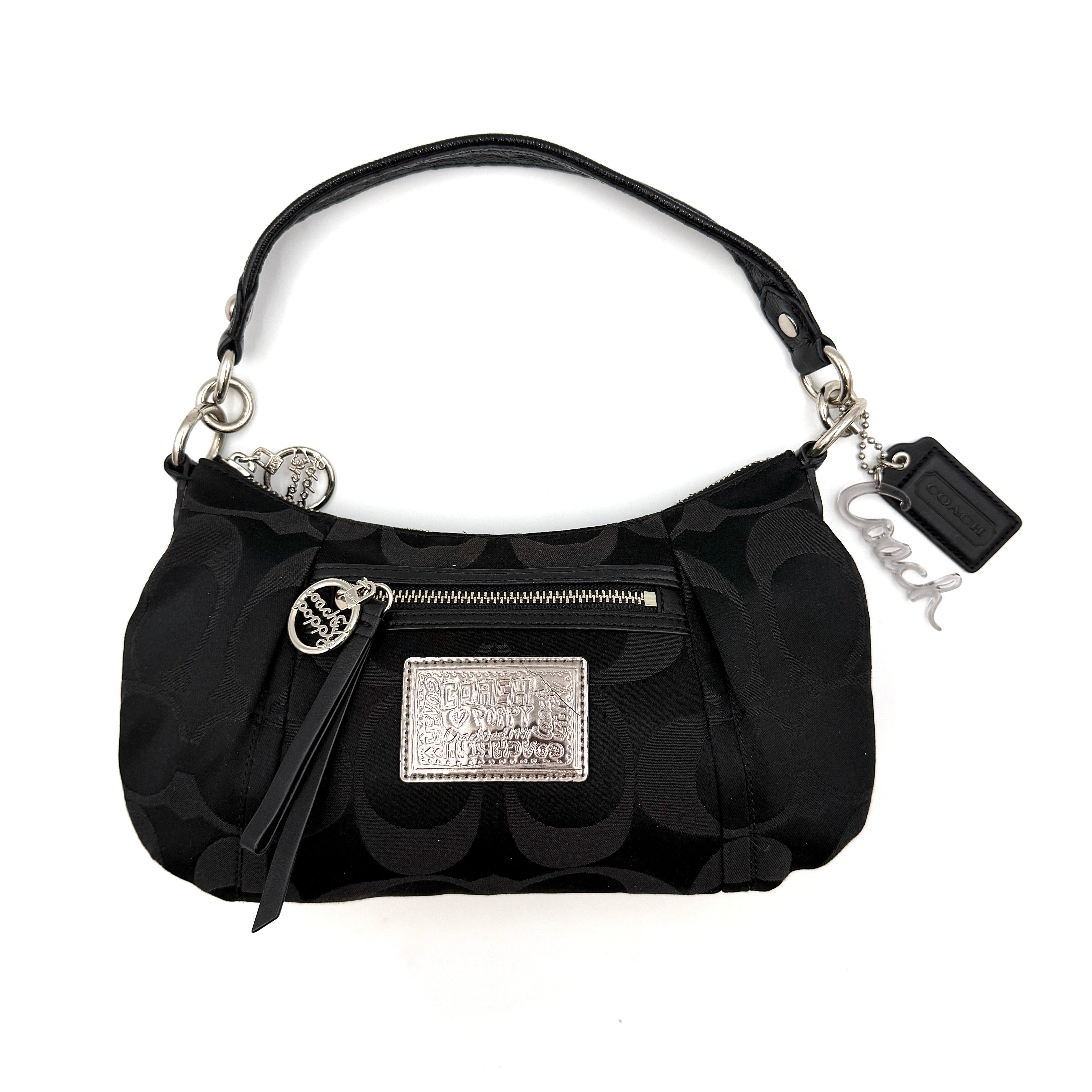 Coach black signature poppy shoulder bag with a front zip pocket, silver-tone hardware, and a sleek shoulder strap