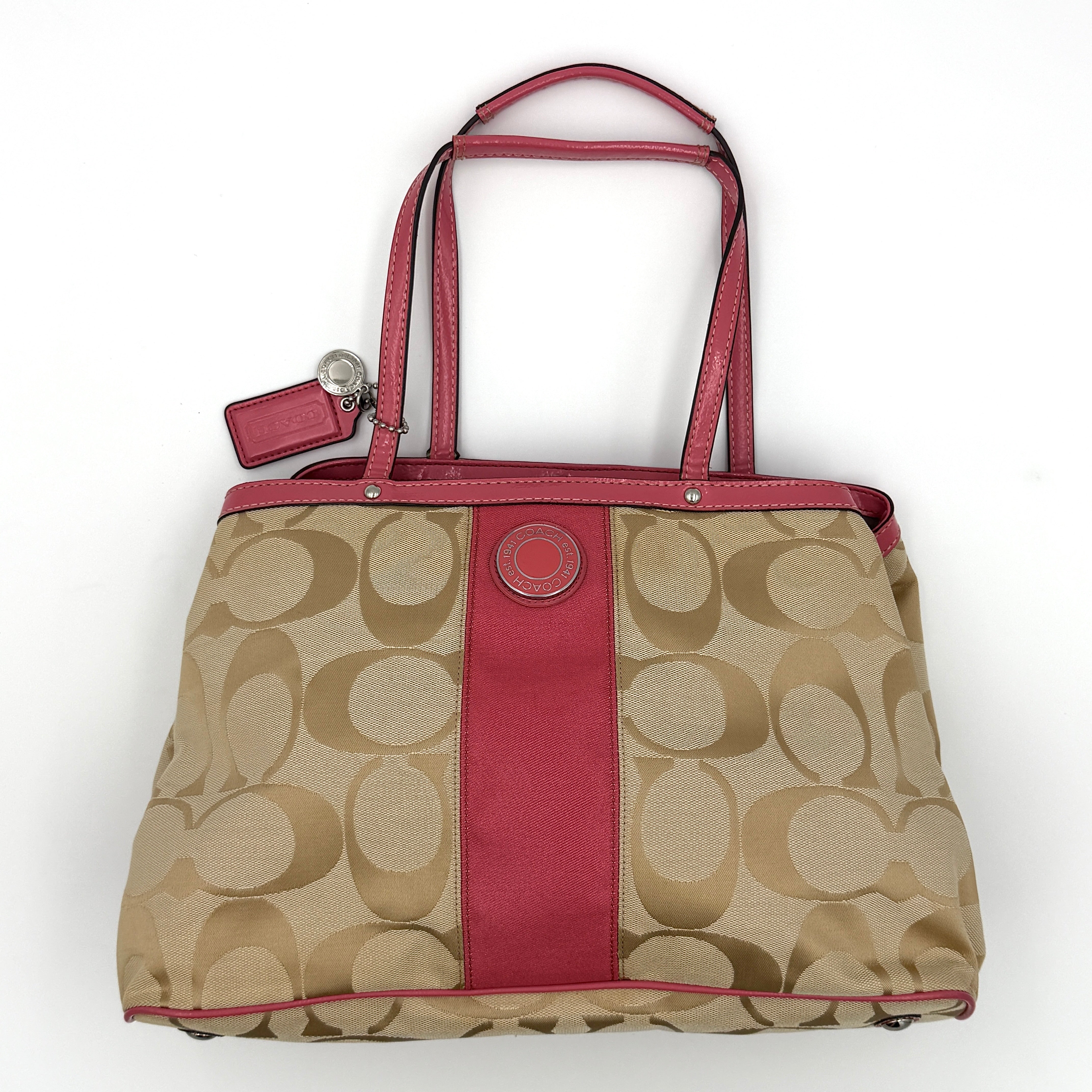 Pre-loved Coach Signature Stripe Kisslock Tote Bag in pink and beige with silver-tone hardware and central kisslock compartment.