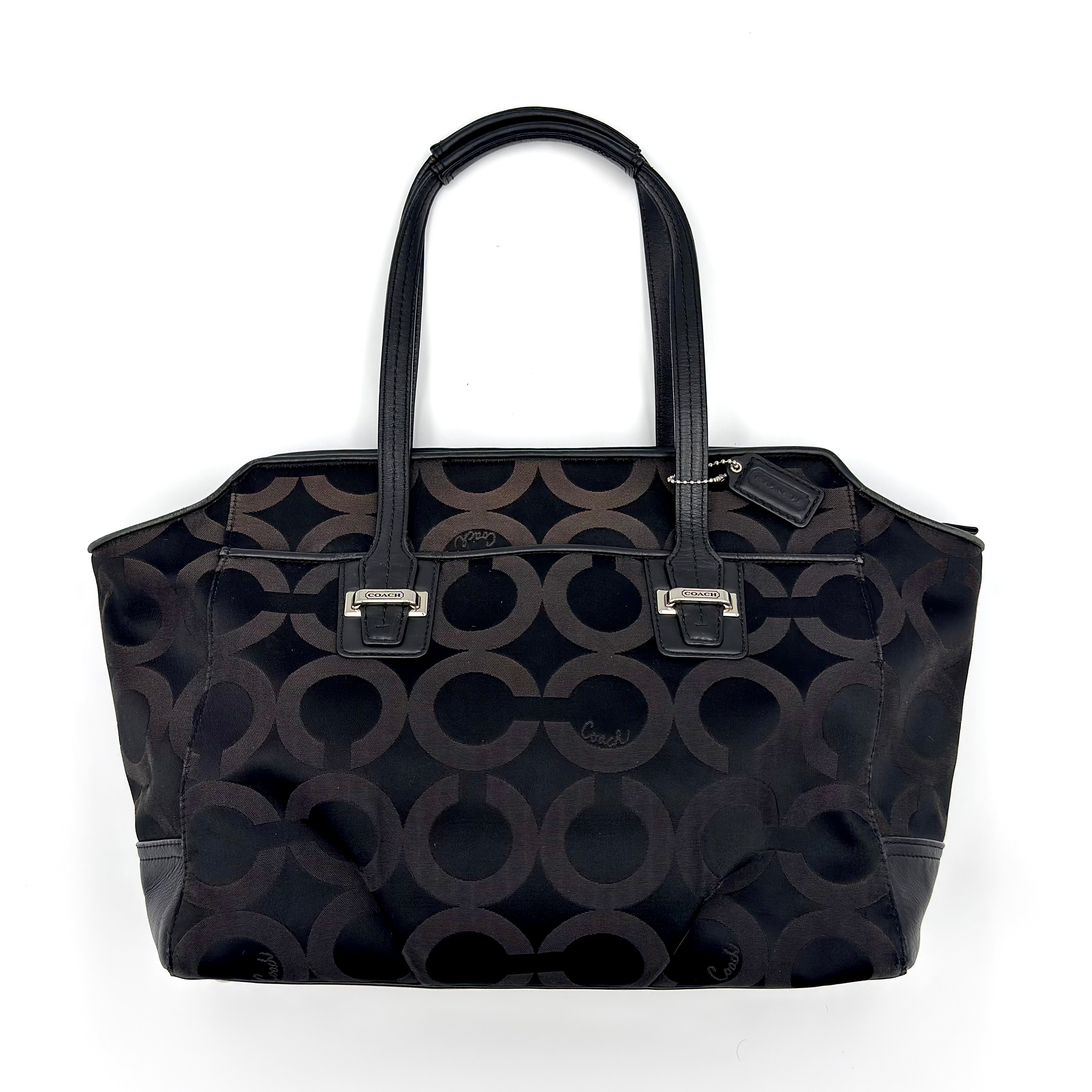 Coach Taylor OP Art Alexis Carryall Tote Bag in black jacquard with tonal monogram pattern, leather trim, and silver hardware.