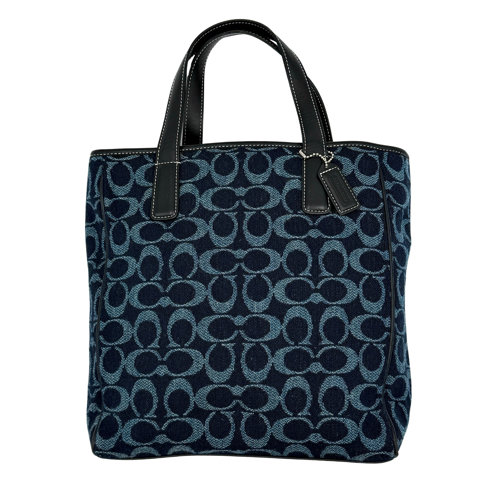 Coach Y2K denim wool tote bag in blue featuring all-over signature monogram pattern, structured silhouette, and double leather top handles.
