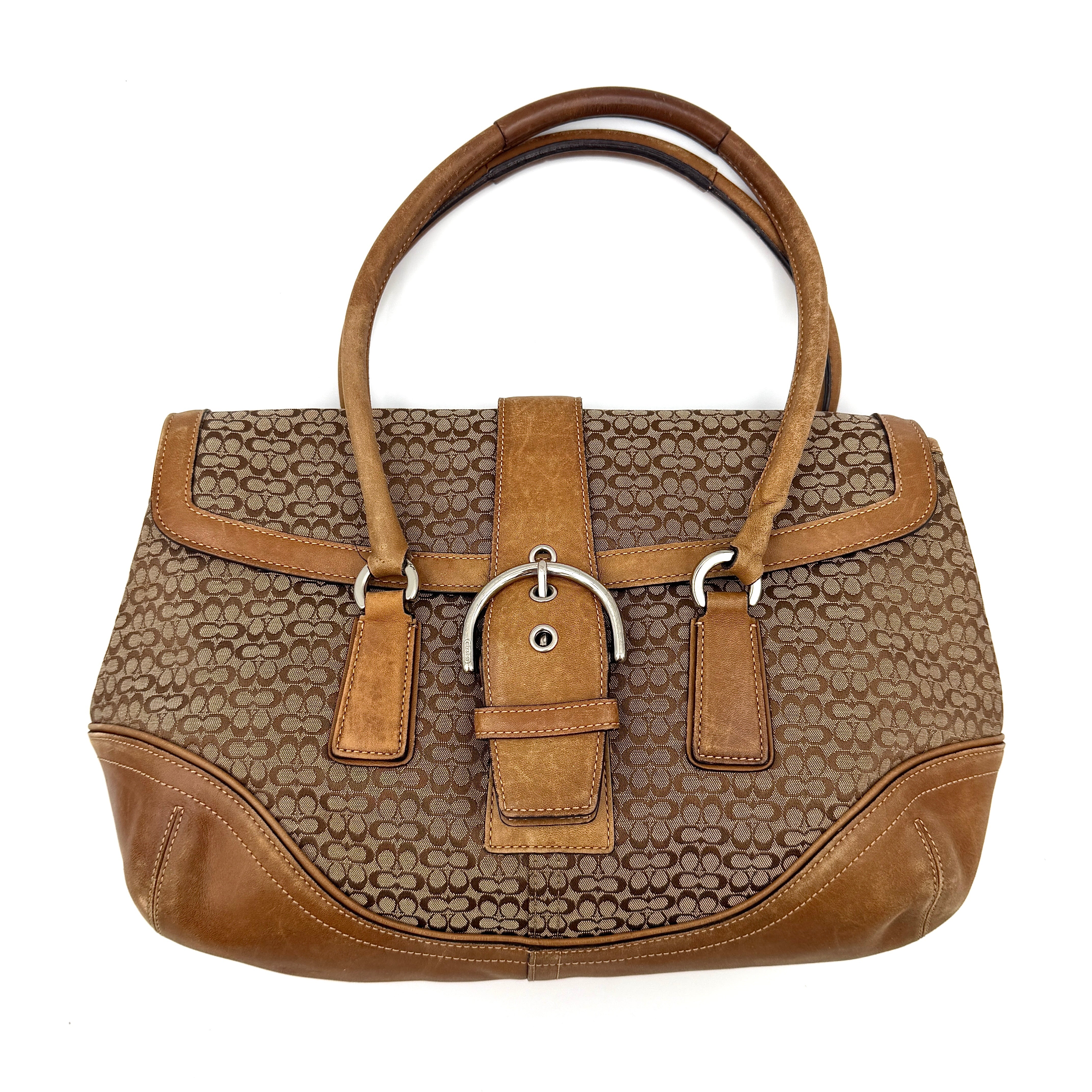 Coach Y2K Signature Soho Shoulder Bag in beige and tan with monogram pattern, leather trim, front buckle detail, and top handle.