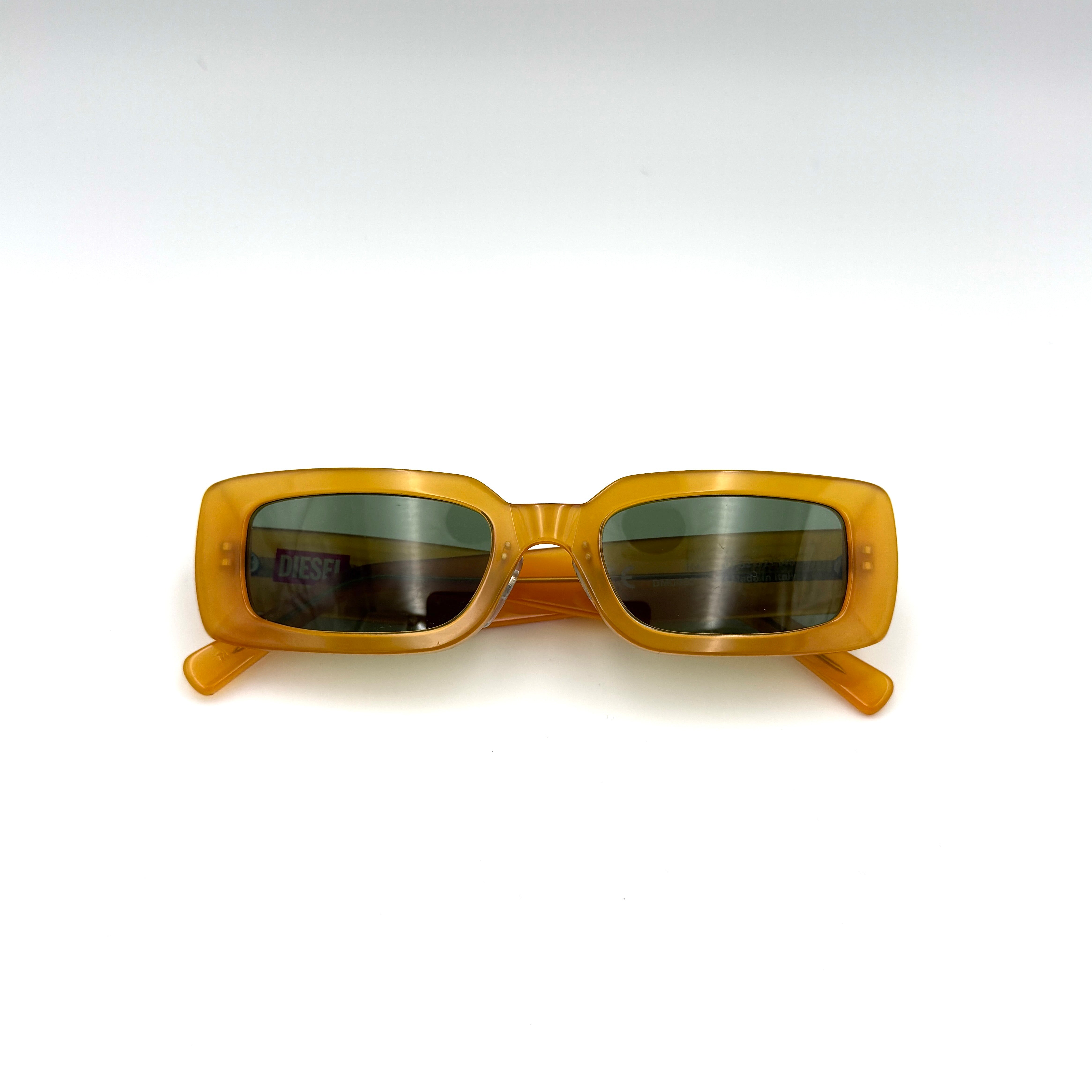 Diesel DM0362 Sunglasses in translucent yellow acetate with rectangular tinted lenses and Diesel logo temples.