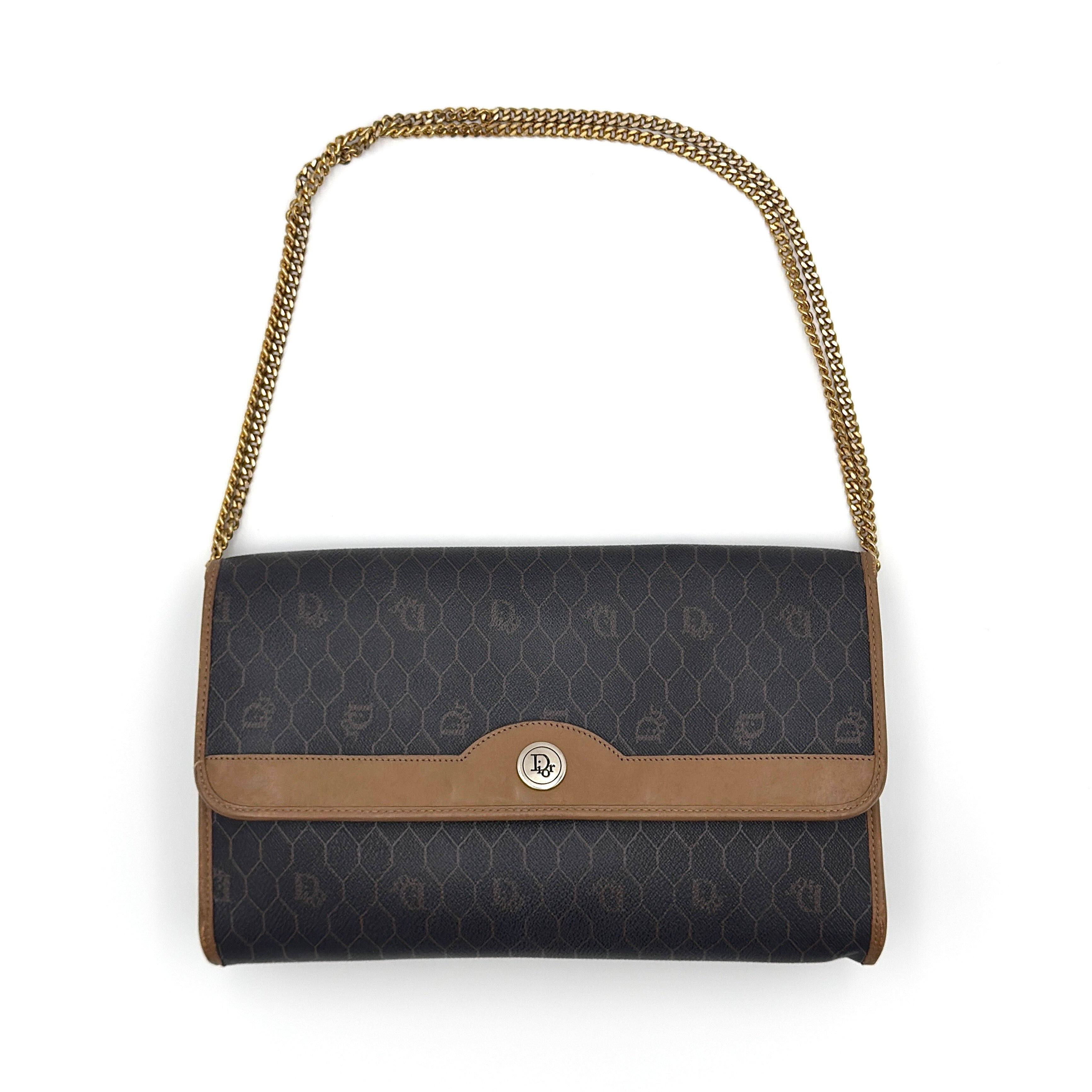 Vintage Christian Dior honeycomb canvas shoulder bag in black and brown with gold-tone chain strap and leather trim.