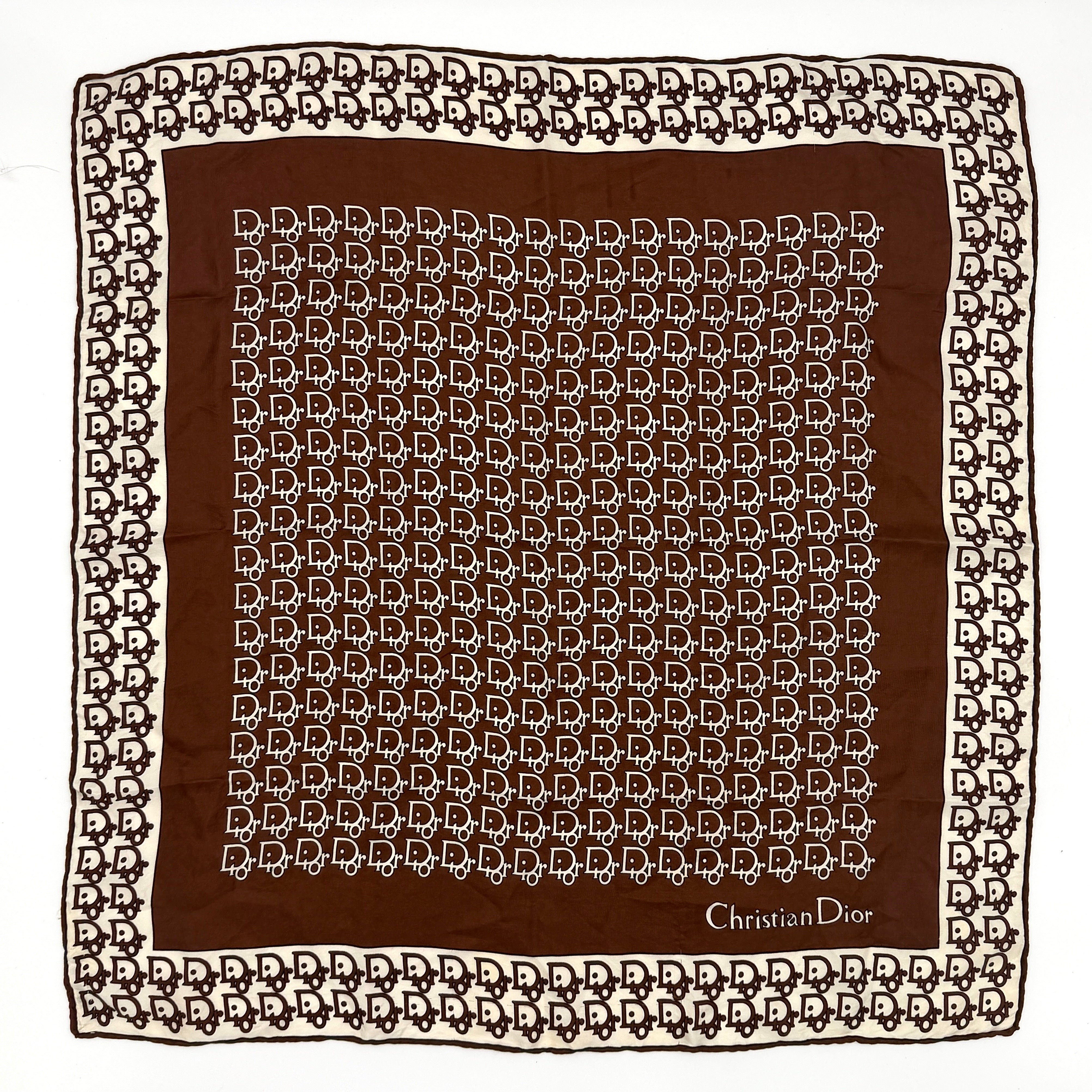 Dior monogram logo silk scarf in brown and white with repeating logo pattern and contrast border.