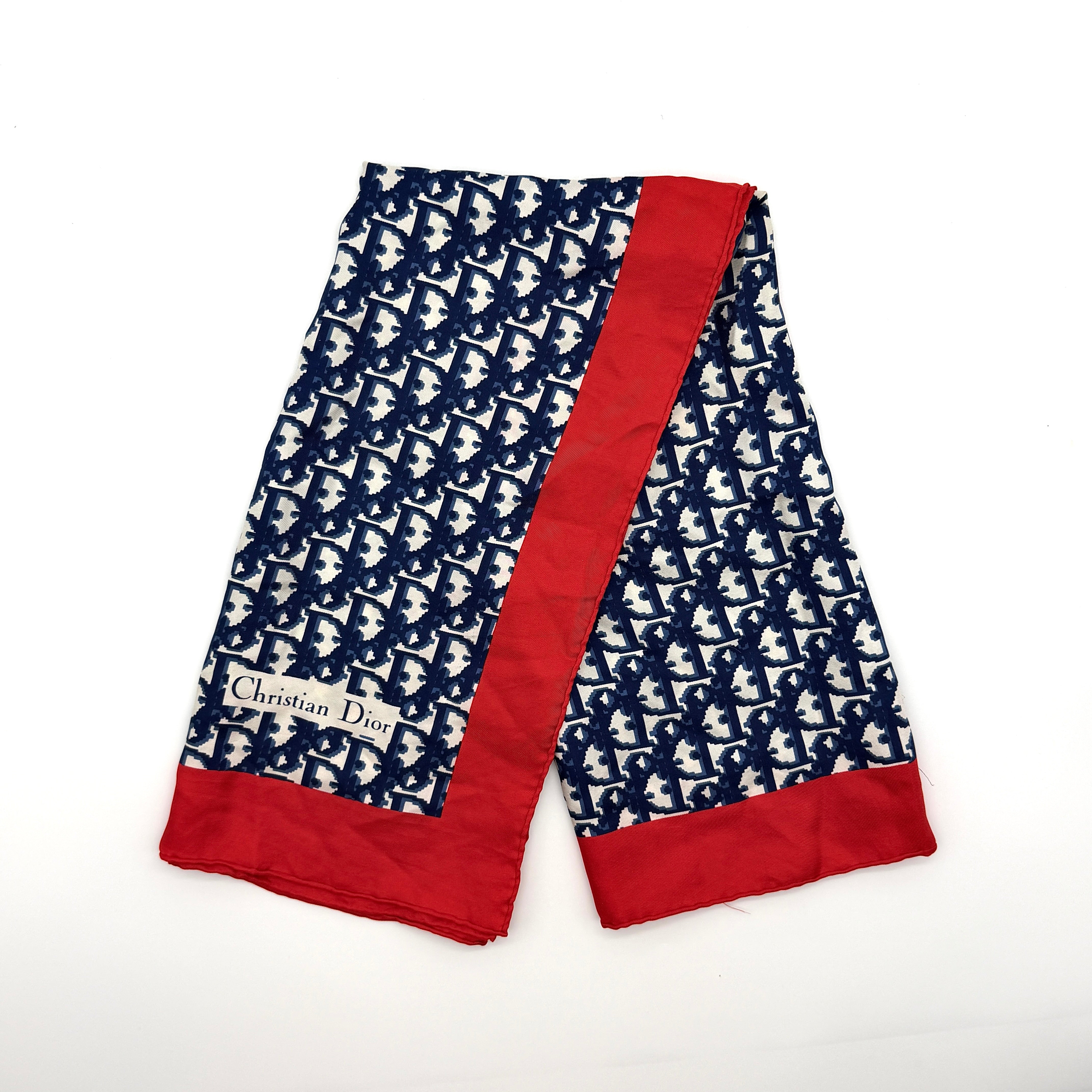 Dior Monogram Silk Scarf in navy and red, crafted from soft silk with an all-over oblique pattern and contrast red border.