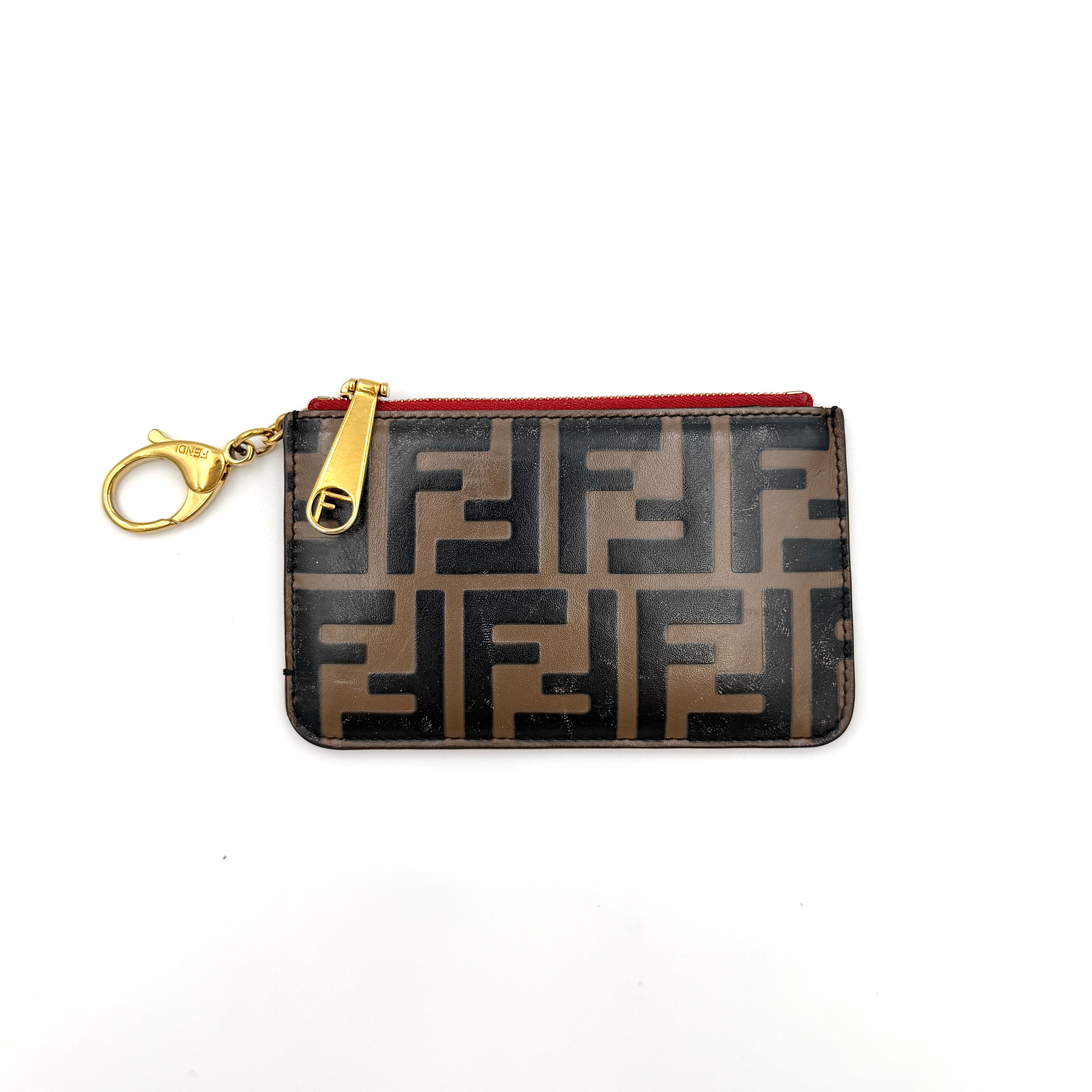 Fendi FF logo coin card pouch in brown coated canvas with red leather interior and gold-tone hardware.