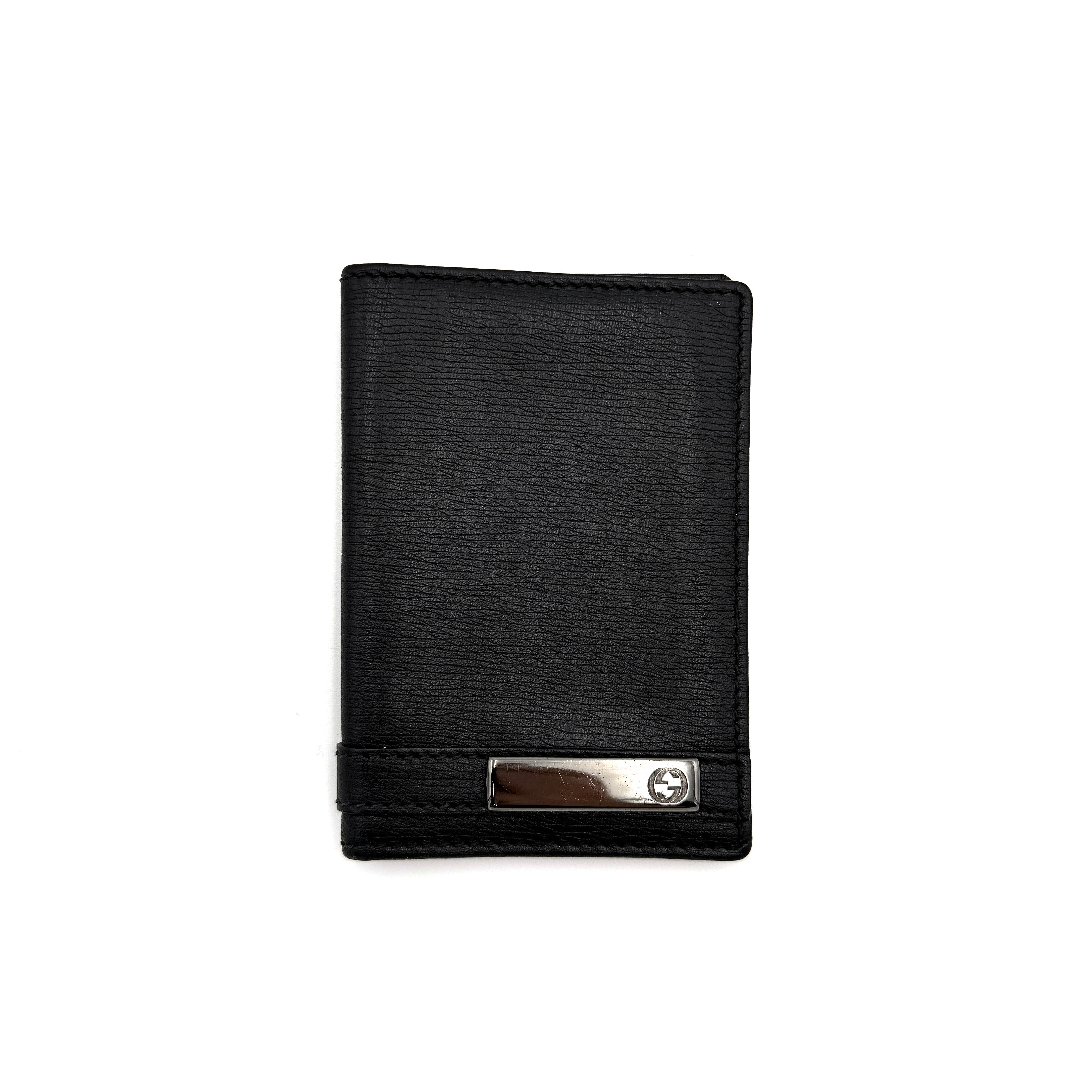 Gucci GG bifold cardholder in black with iconic pattern and sleek design