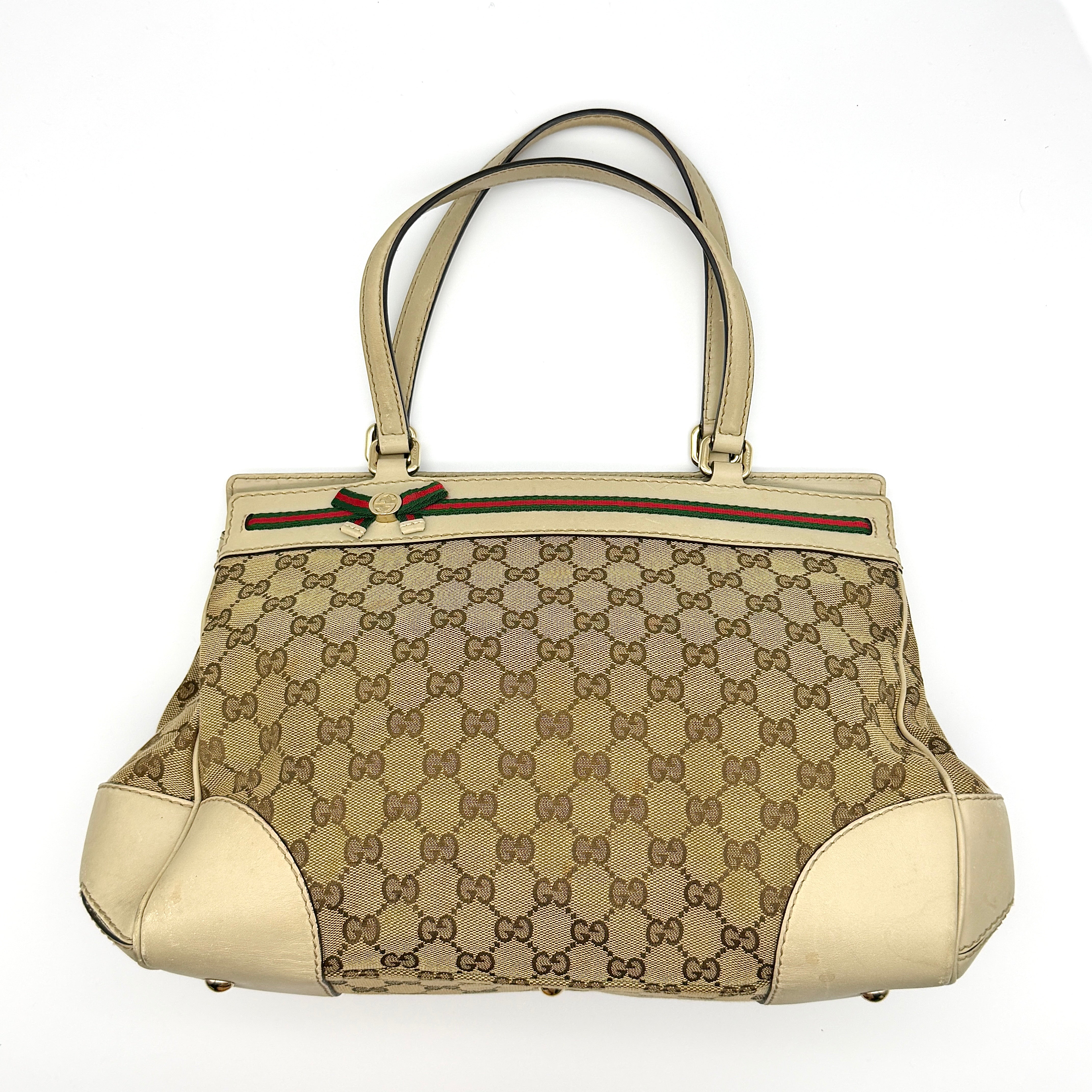 Gucci GG Monogram Ribbon Shoulder Bag in Beige and White canvas, featuring green-red web bow detail and white leather corners